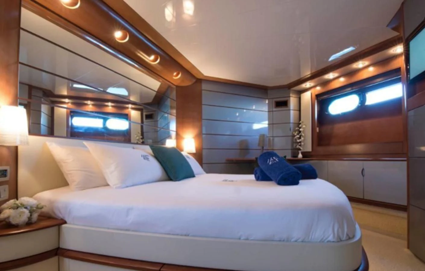 a bed with white sheets aboard 4F Yacht for Sale