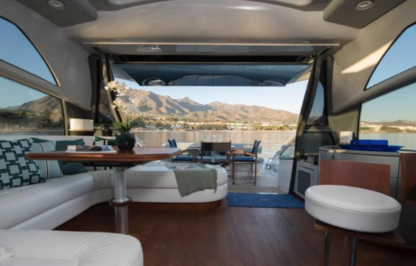 a room with a table and chairs aboard 4F Yacht for Sale