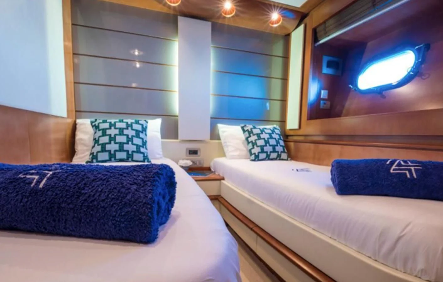a couple of beds in a room aboard 4F Yacht for Sale