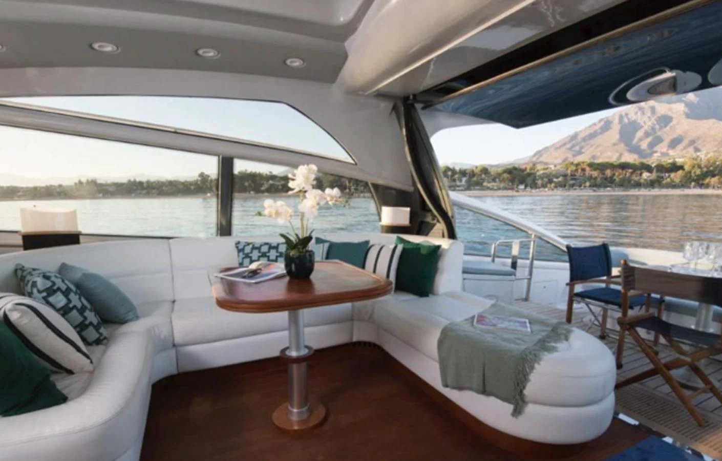 a room with a table and chairs aboard 4F Yacht for Sale