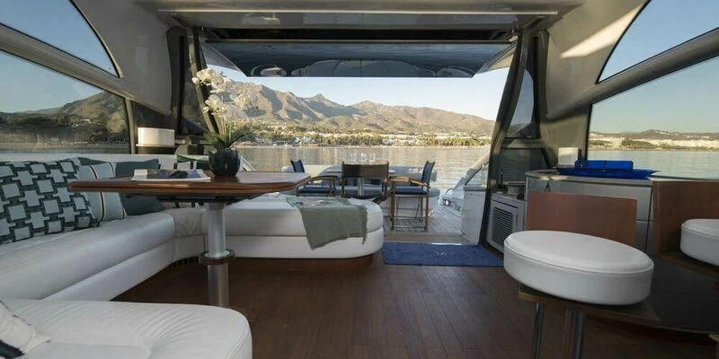 a room with a table and chairs aboard 4F Yacht for Sale
