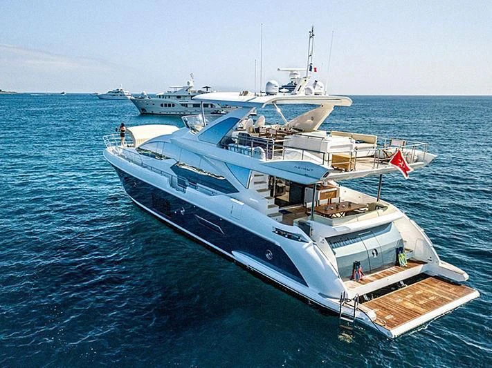 a large white boat in the water aboard INVICTUS Yacht for Sale