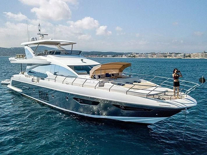 a person standing on a boat aboard INVICTUS Yacht for Sale