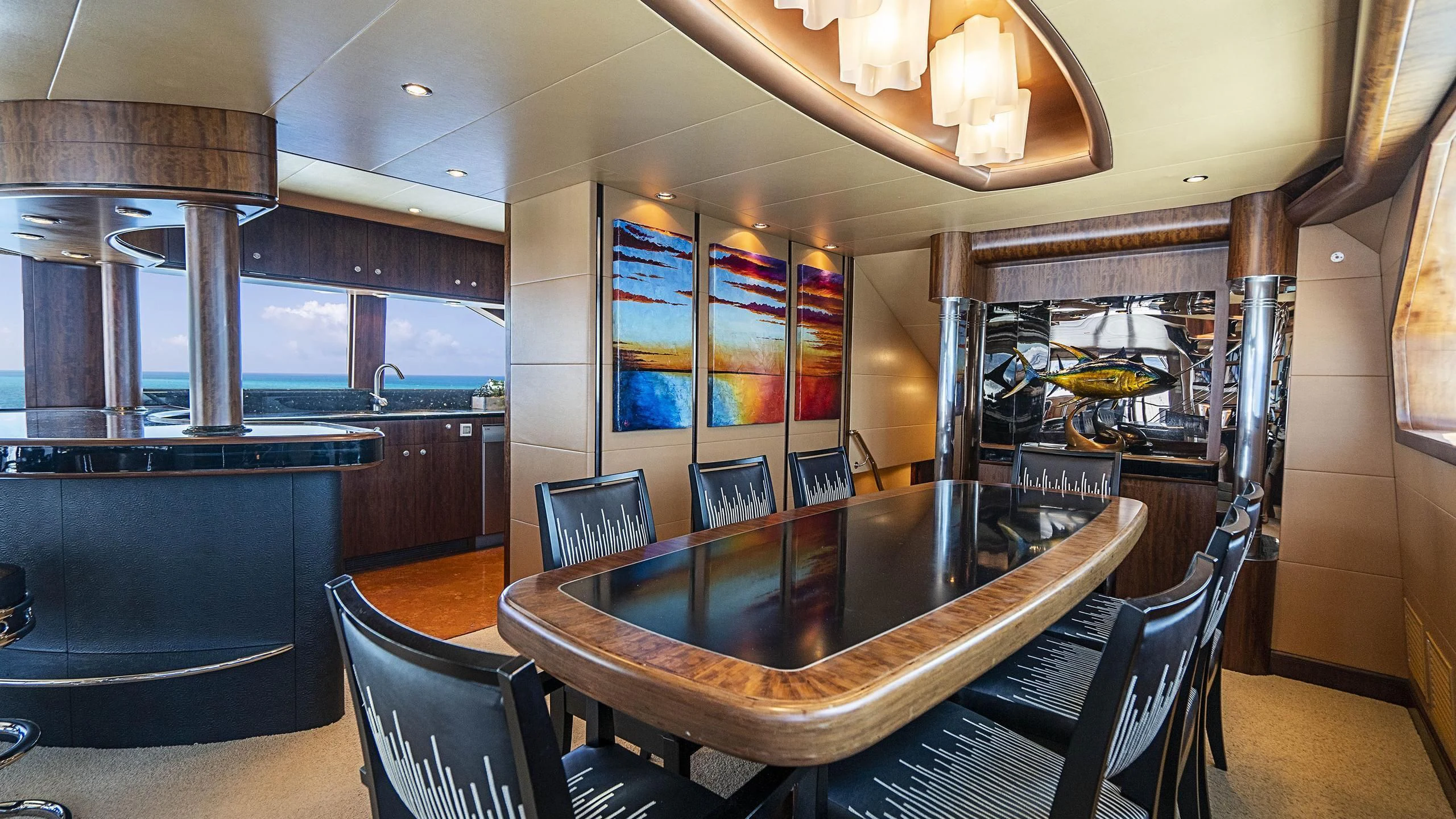 a large dining table in a room aboard GRAND LEGACY Yacht for Sale