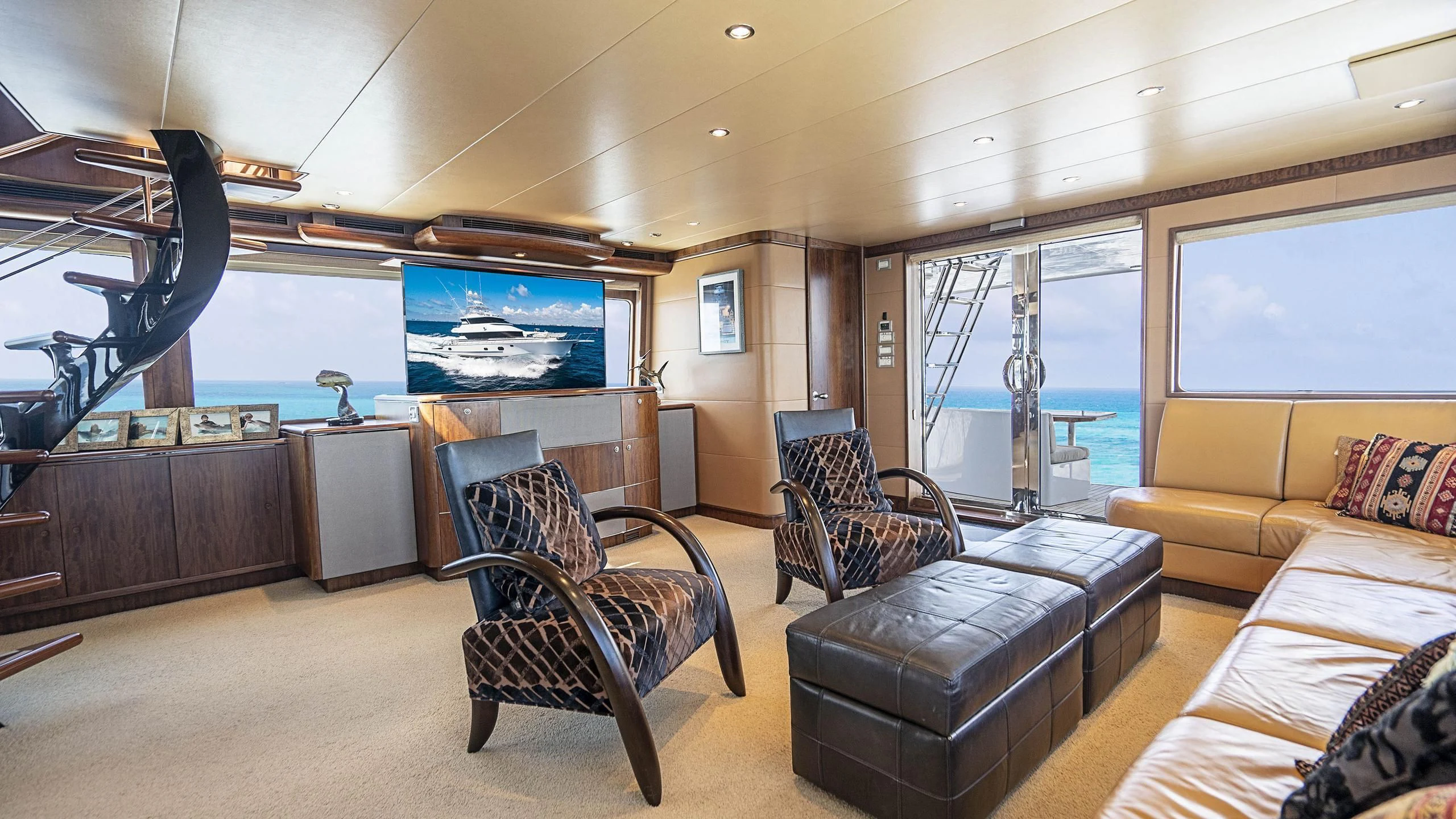 a living room with a large window aboard GRAND LEGACY Yacht for Sale