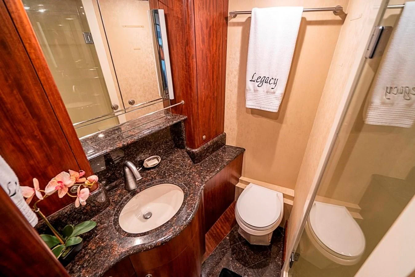 a bathroom with a sink and toilet aboard GRAND LEGACY Yacht for Sale