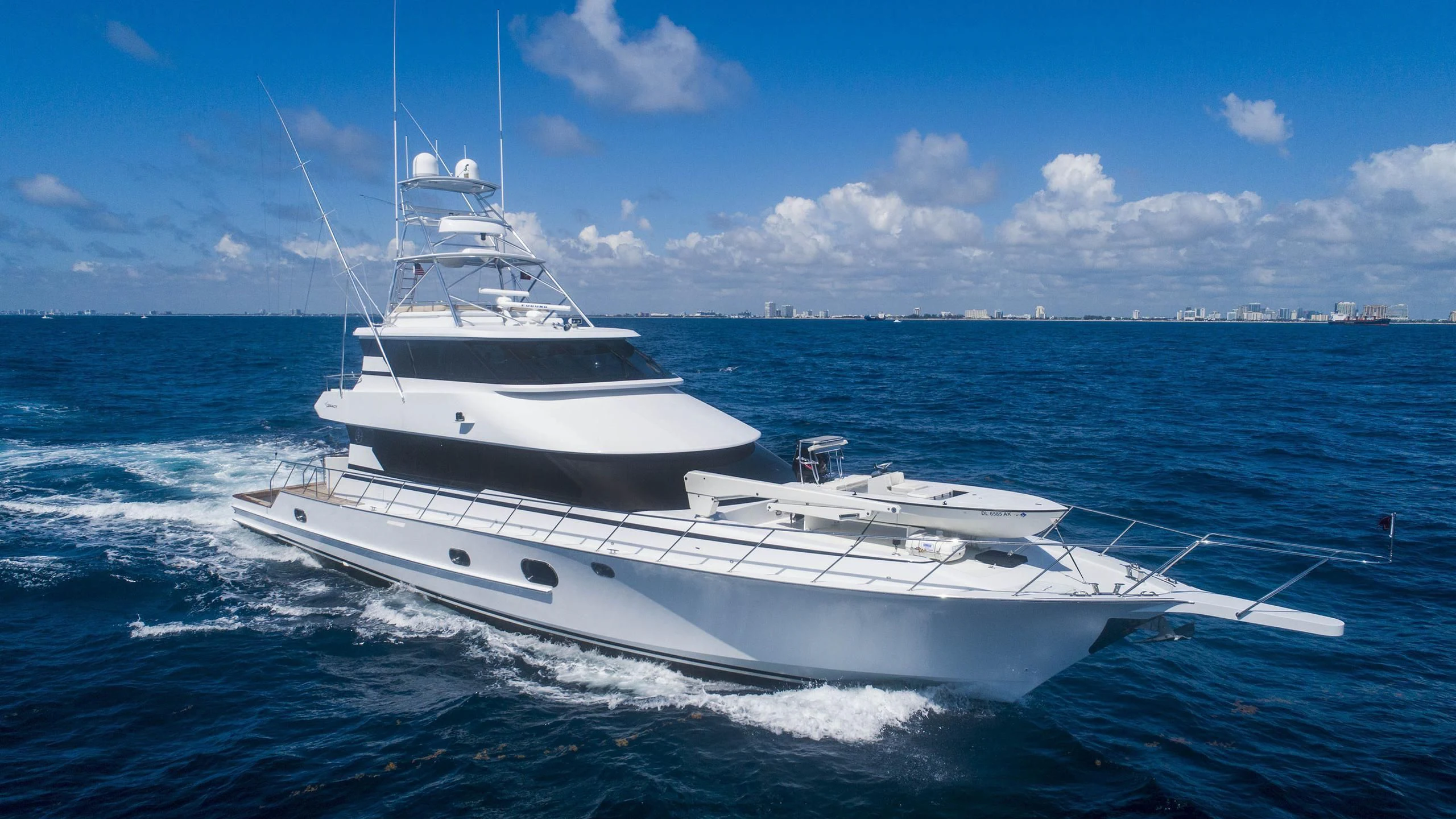 a white yacht in the water aboard GRAND LEGACY Yacht for Sale