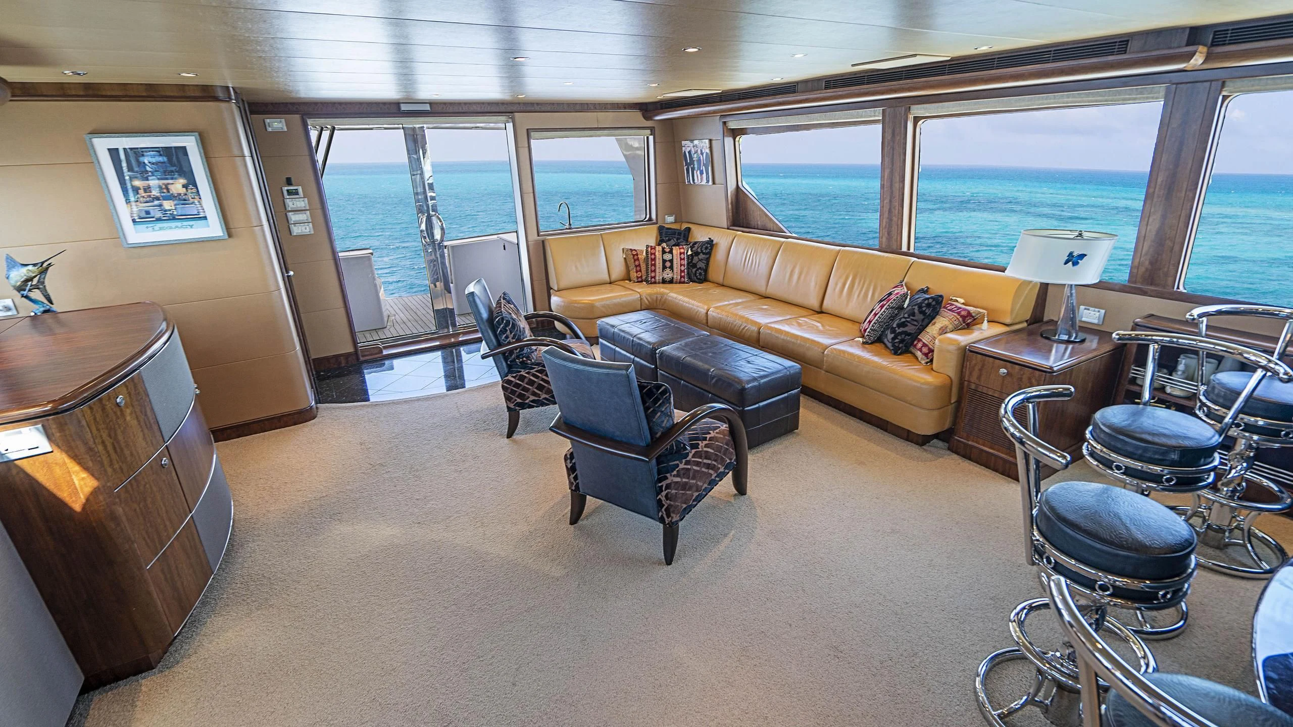 a living room with a couch and a table aboard GRAND LEGACY Yacht for Sale