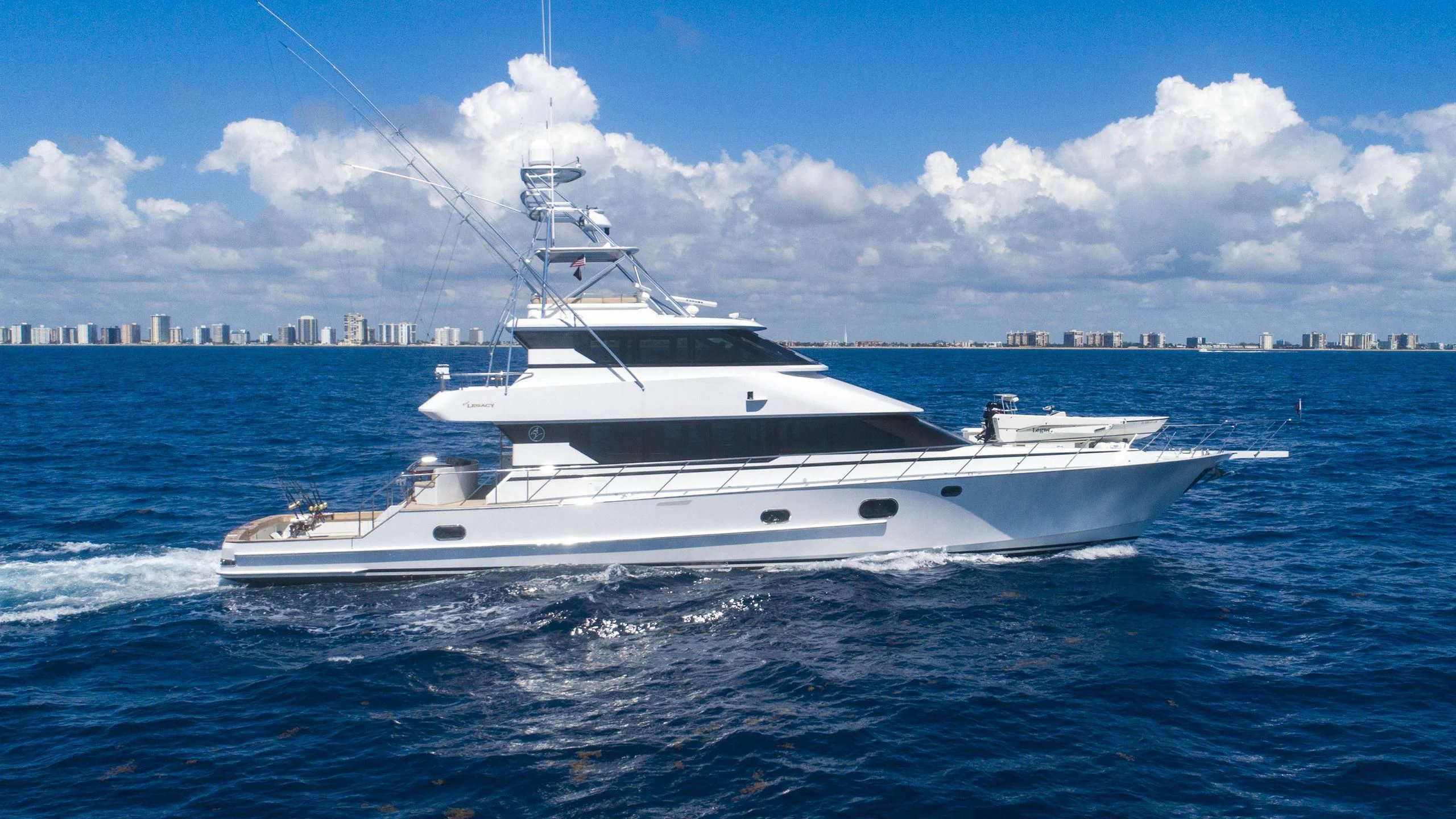 a white yacht on the water aboard GRAND LEGACY Yacht for Sale