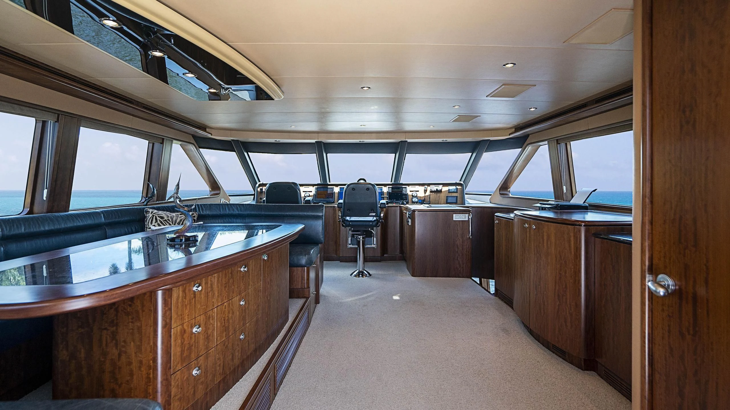 inside of a vehicle with a desk and chairs aboard GRAND LEGACY Yacht for Sale