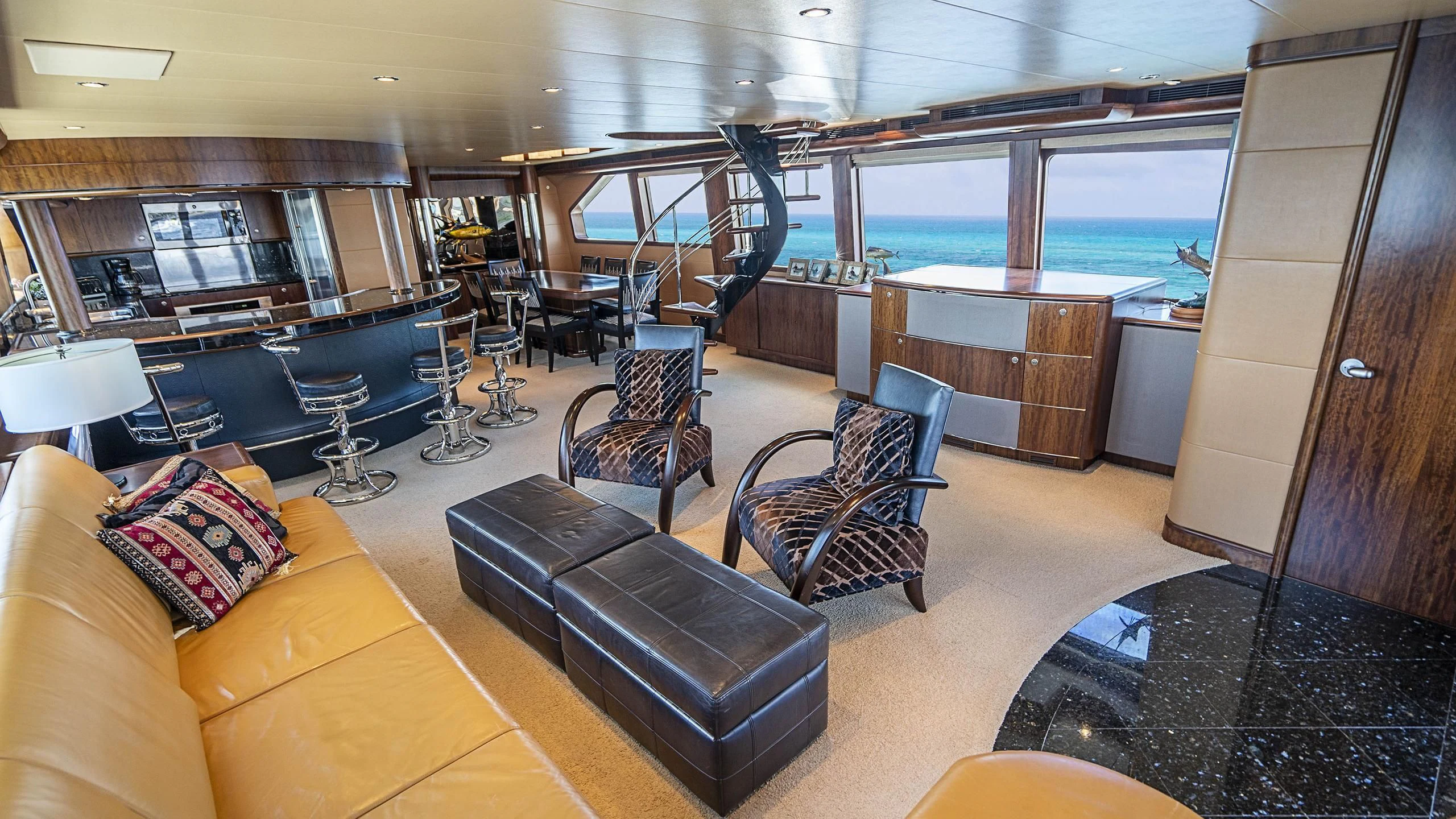 a living room with a large window aboard GRAND LEGACY Yacht for Sale