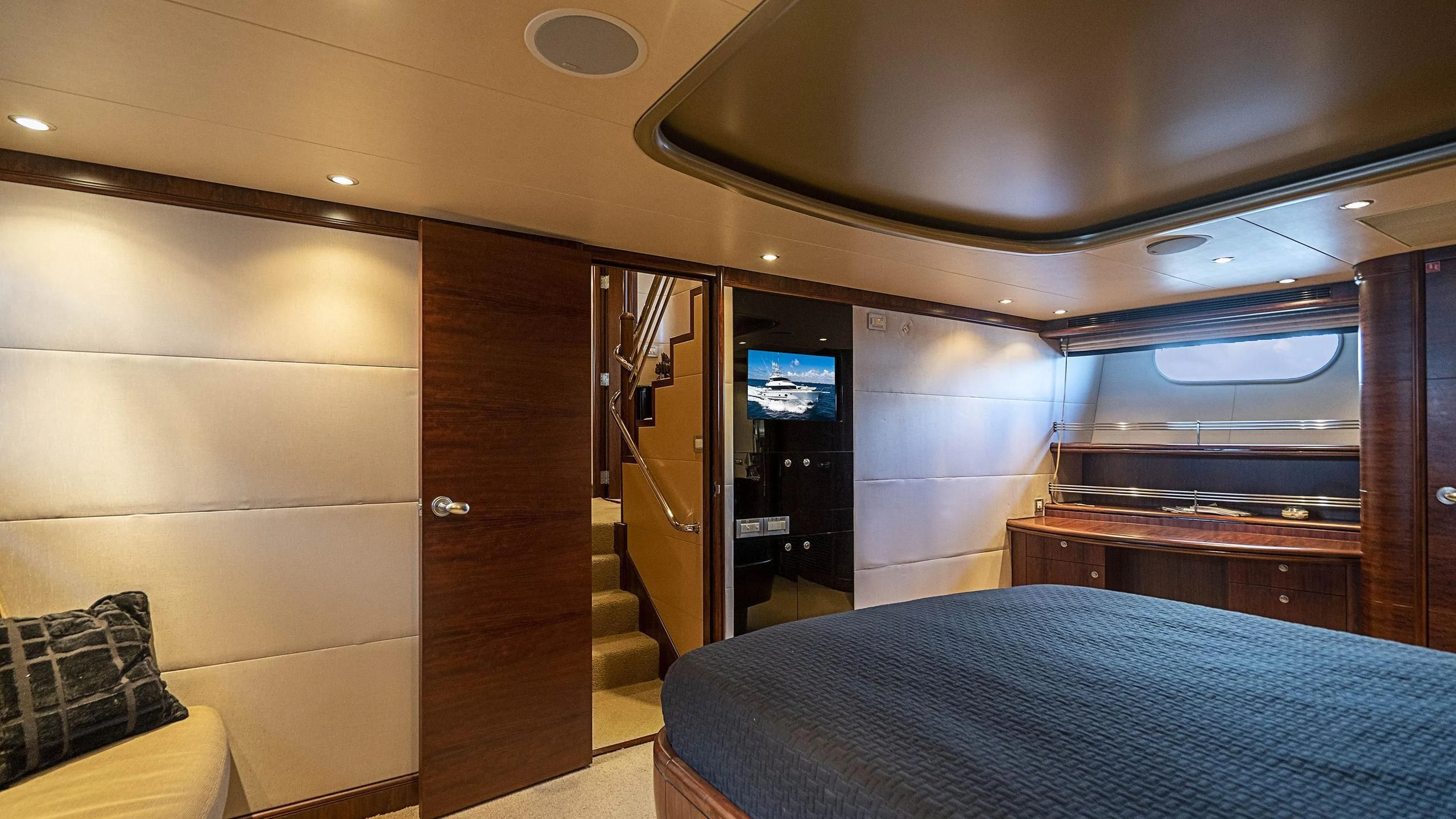 a room with a bed and a tv aboard GRAND LEGACY Yacht for Sale