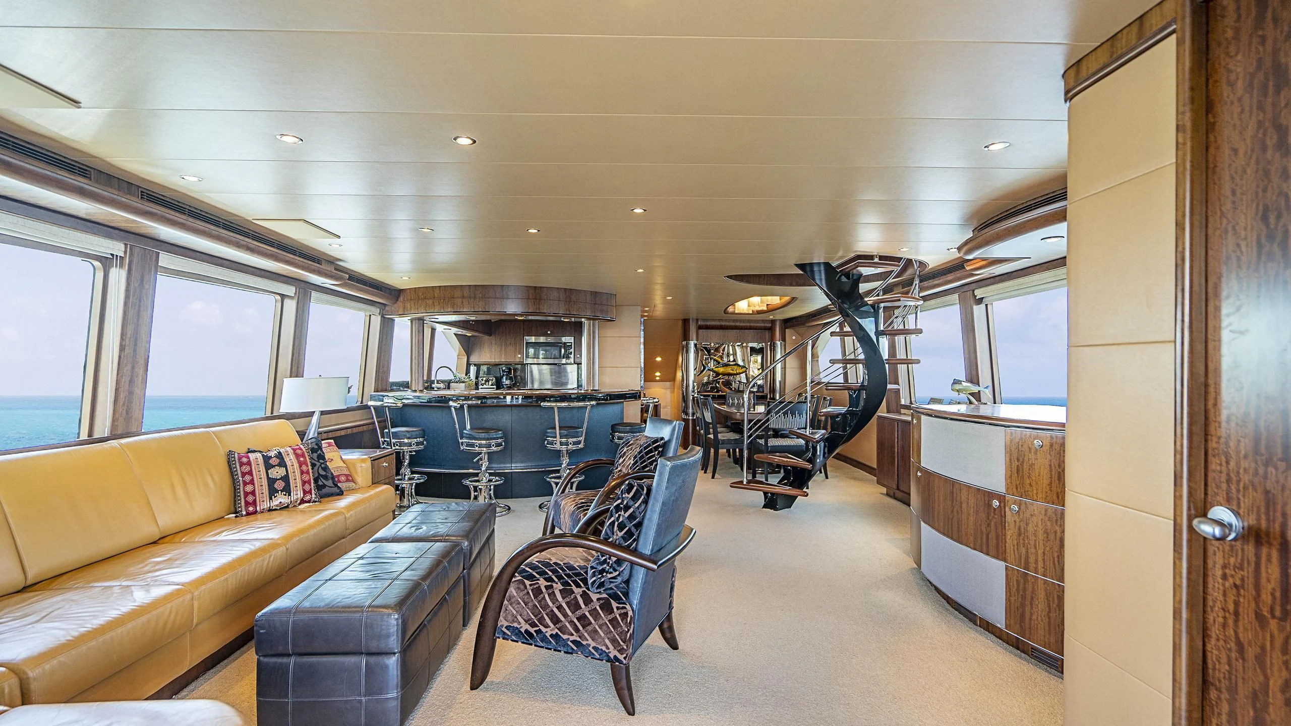 a living room with a couch and a table aboard GRAND LEGACY Yacht for Sale
