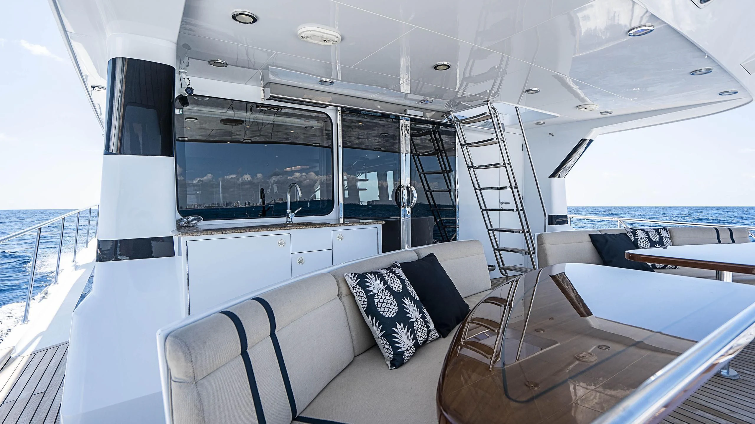 a boat with a white table and chairs aboard GRAND LEGACY Yacht for Sale