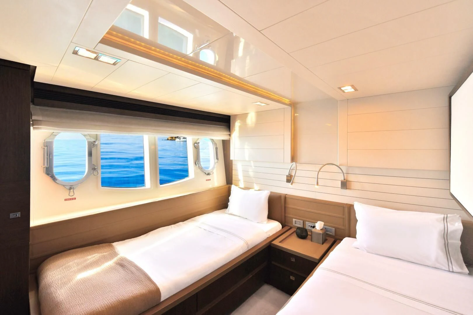 a room with two beds aboard INFINITAS Yacht for Charter