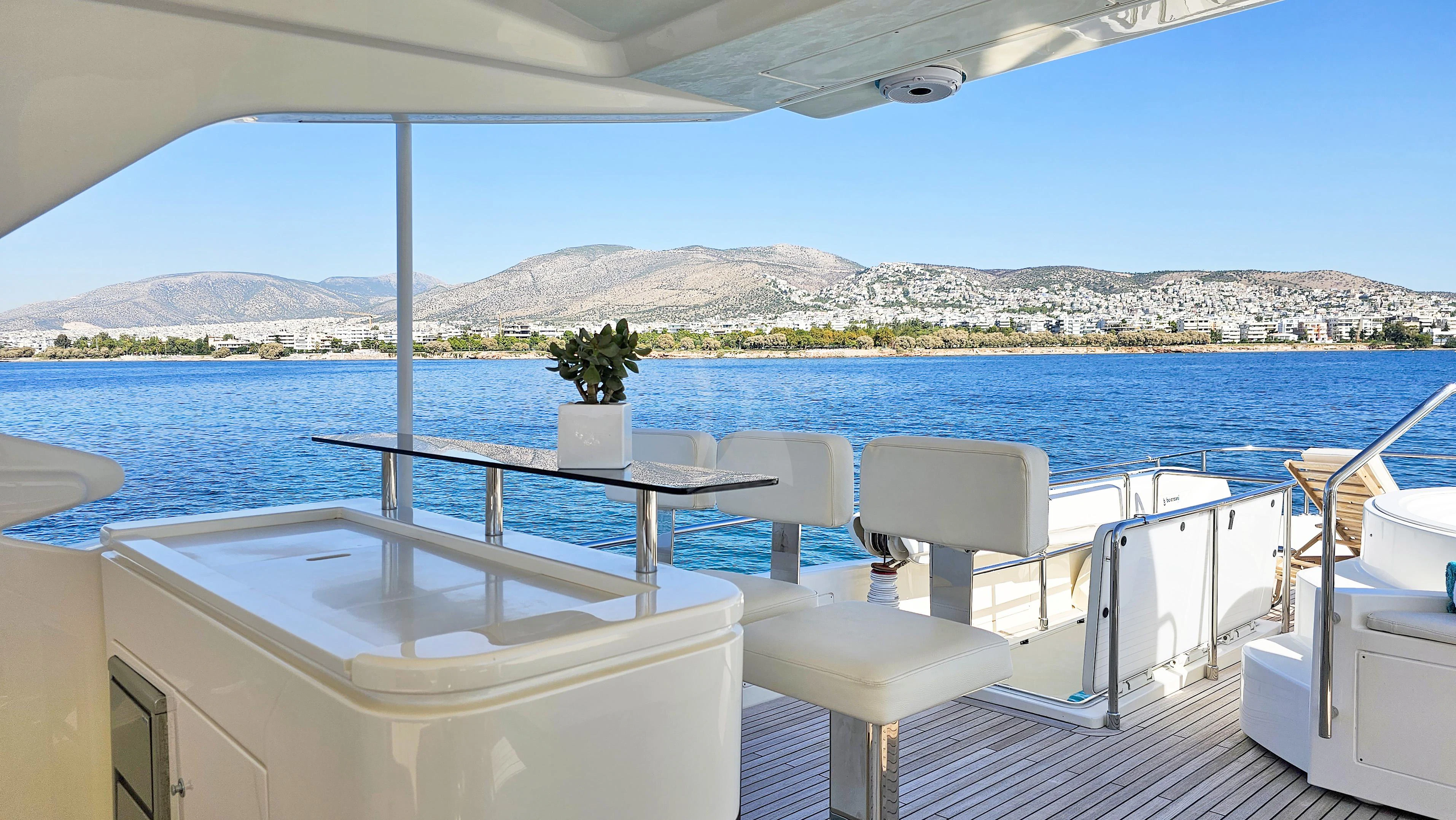 a table and chairs on a boat aboard INFINITAS Yacht for Charter