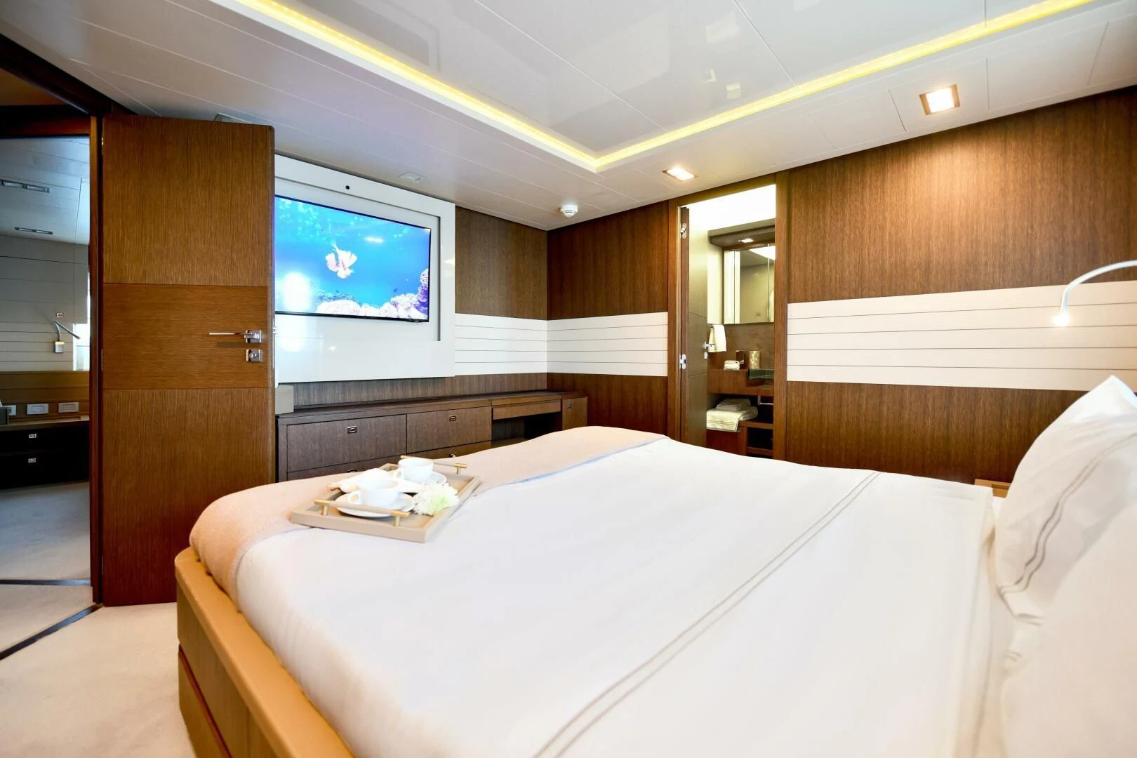 a hotel room with a bed aboard INFINITAS Yacht for Charter