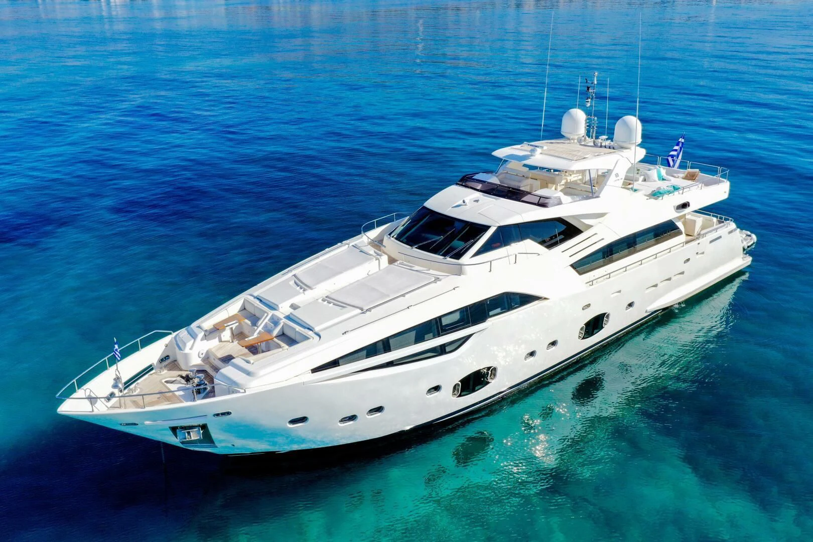a white yacht in the water aboard INFINITAS Yacht for Charter