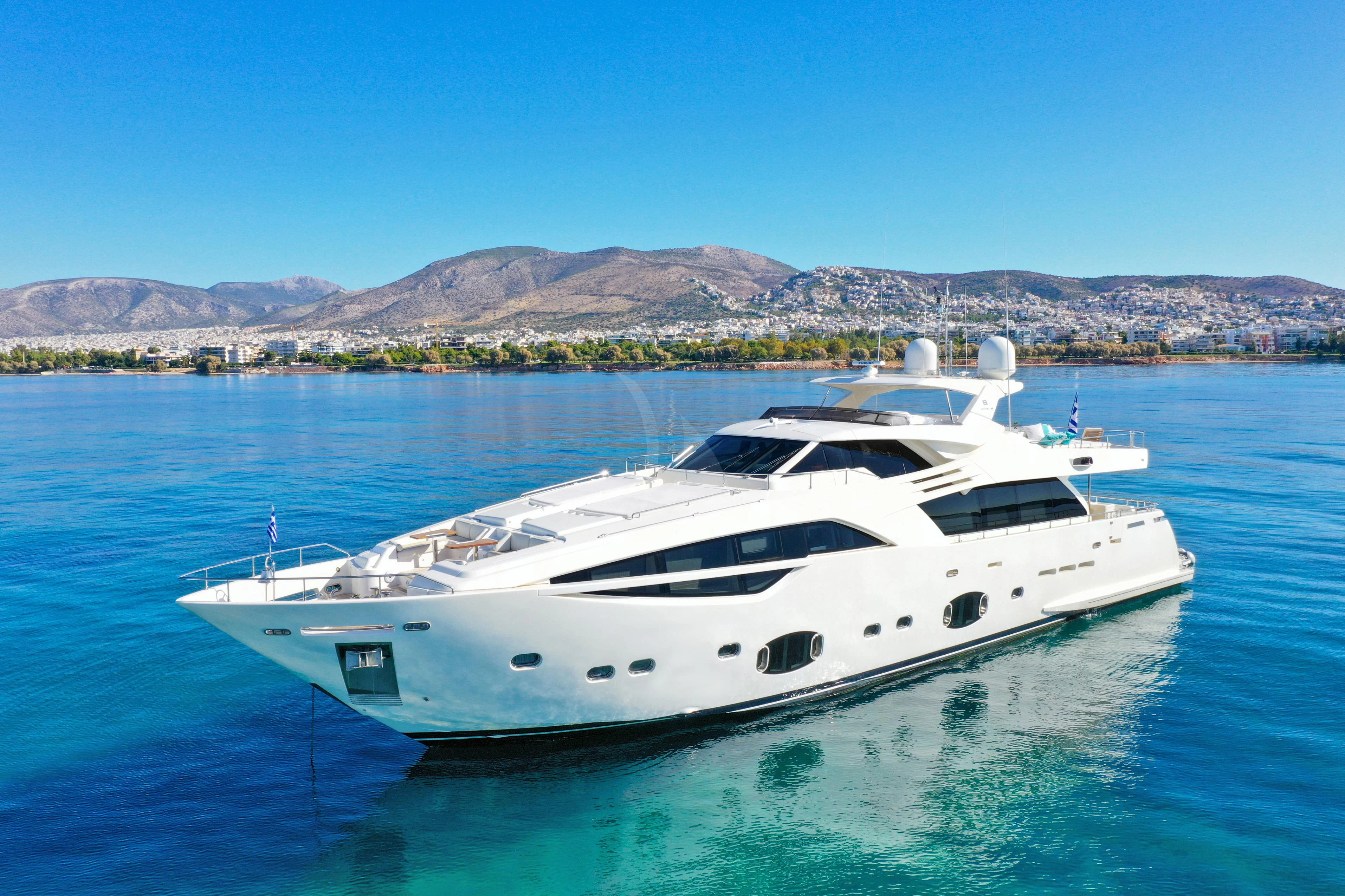 a white yacht in the water aboard INFINITAS Yacht for Charter
