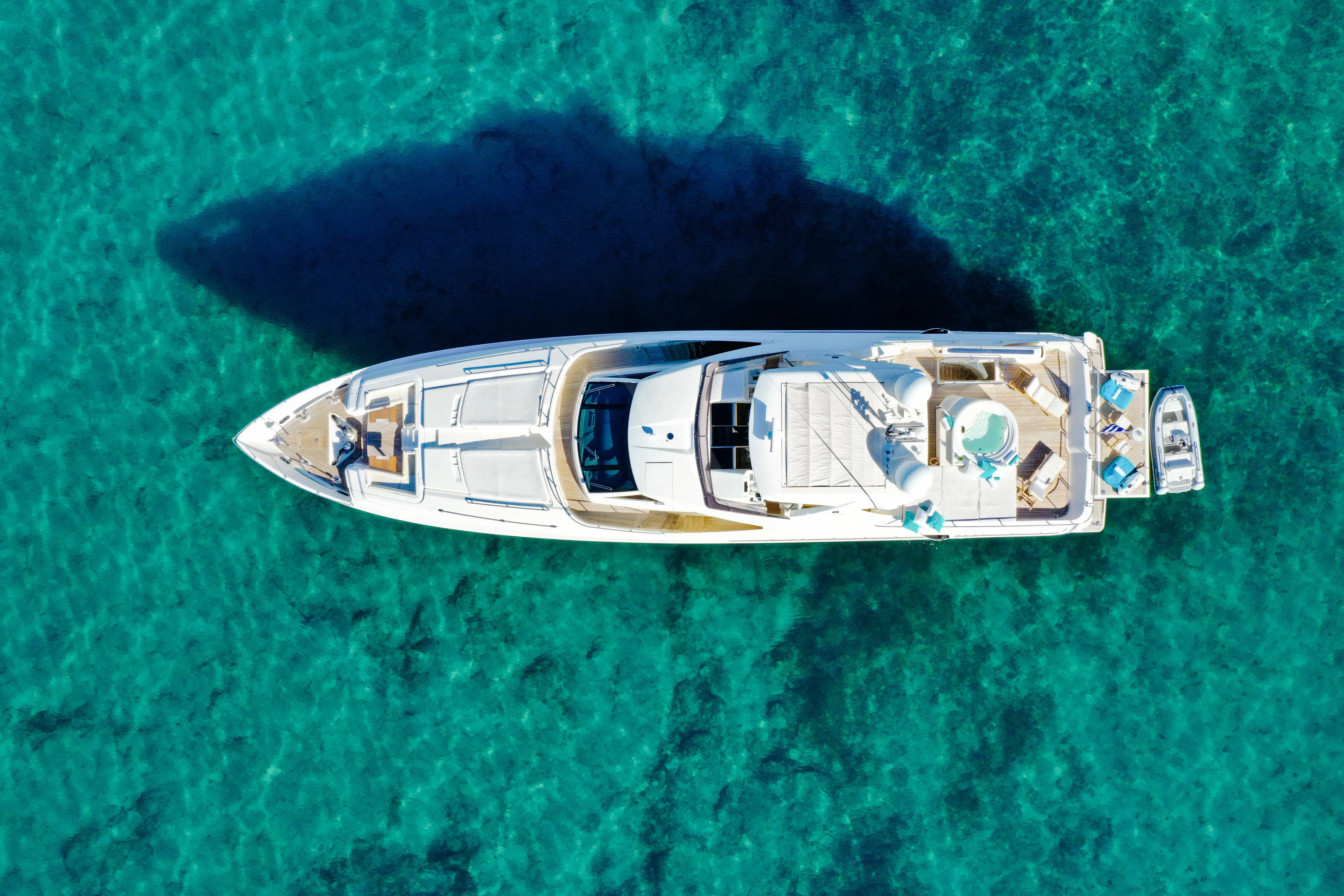 a small silver car on a grass field aboard INFINITAS Yacht for Charter