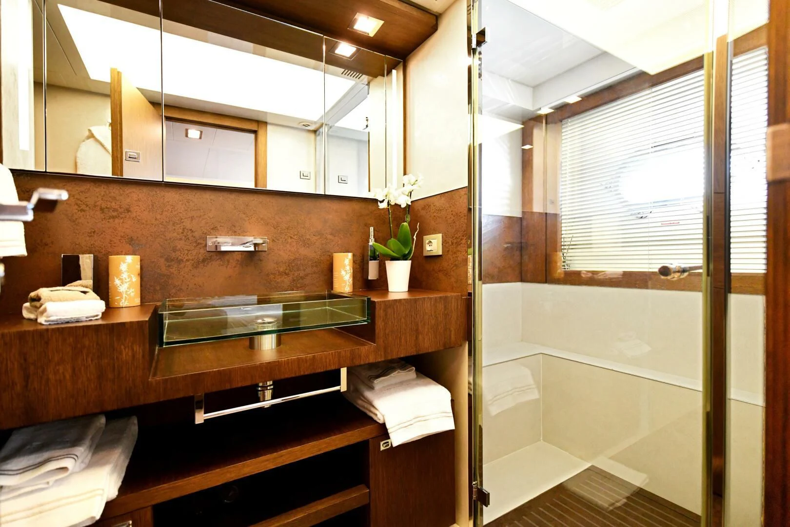 a bathroom with a sink and a bathtub aboard INFINITAS Yacht for Charter