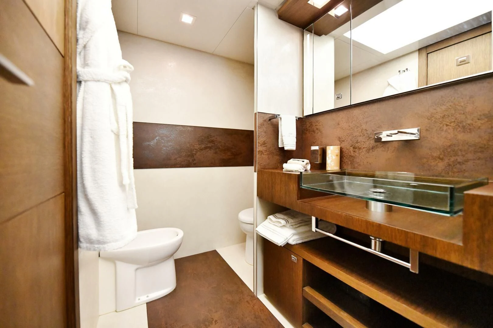 a bathroom with a sink and a toilet aboard INFINITAS Yacht for Charter