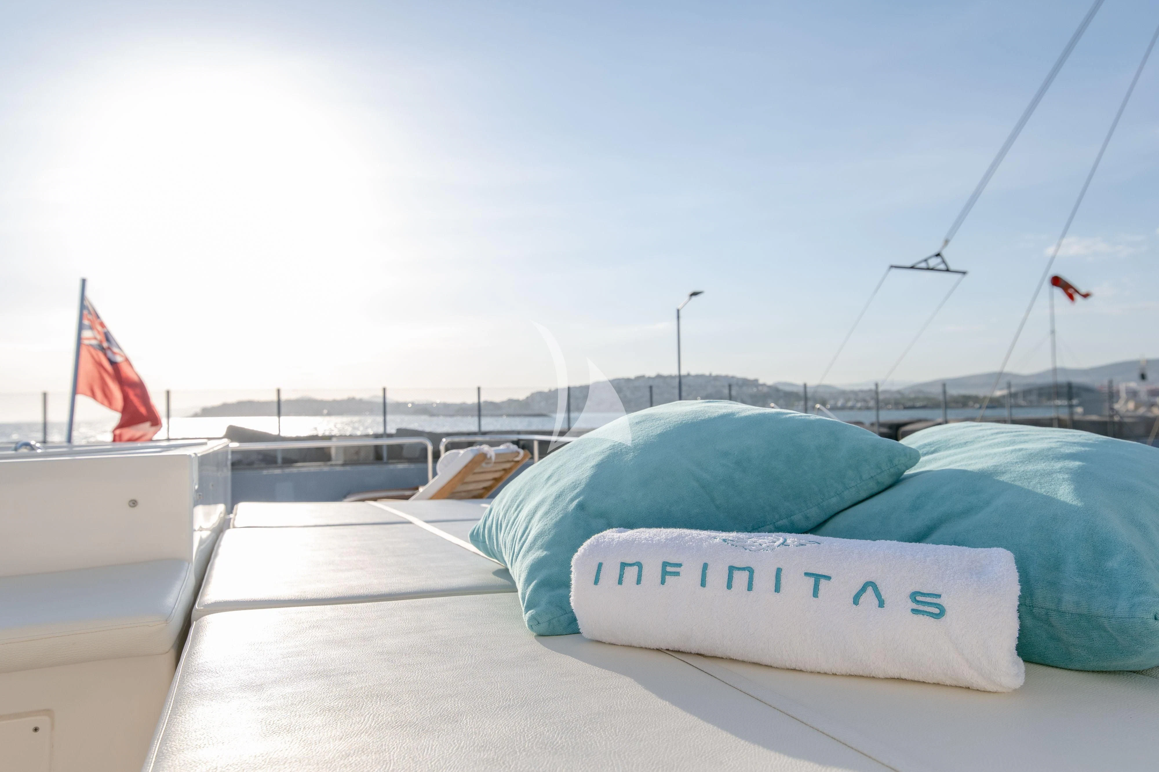 a surfboard on a deck aboard INFINITAS Yacht for Charter