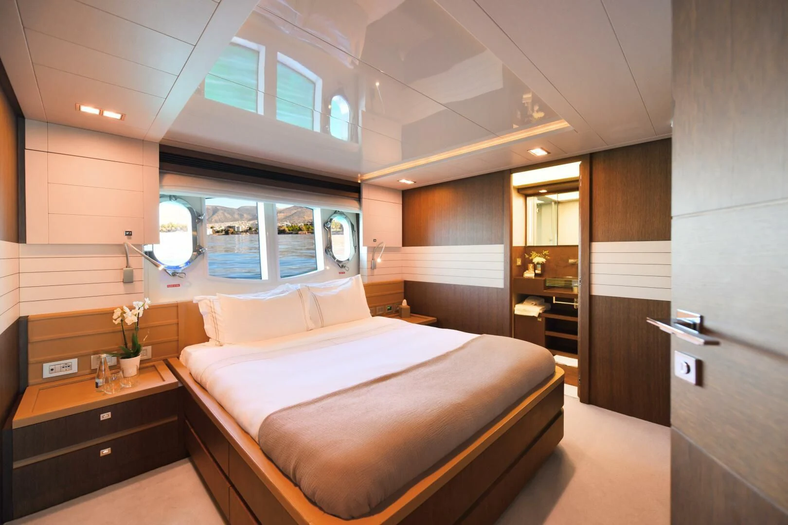 a bed in a room aboard INFINITAS Yacht for Charter