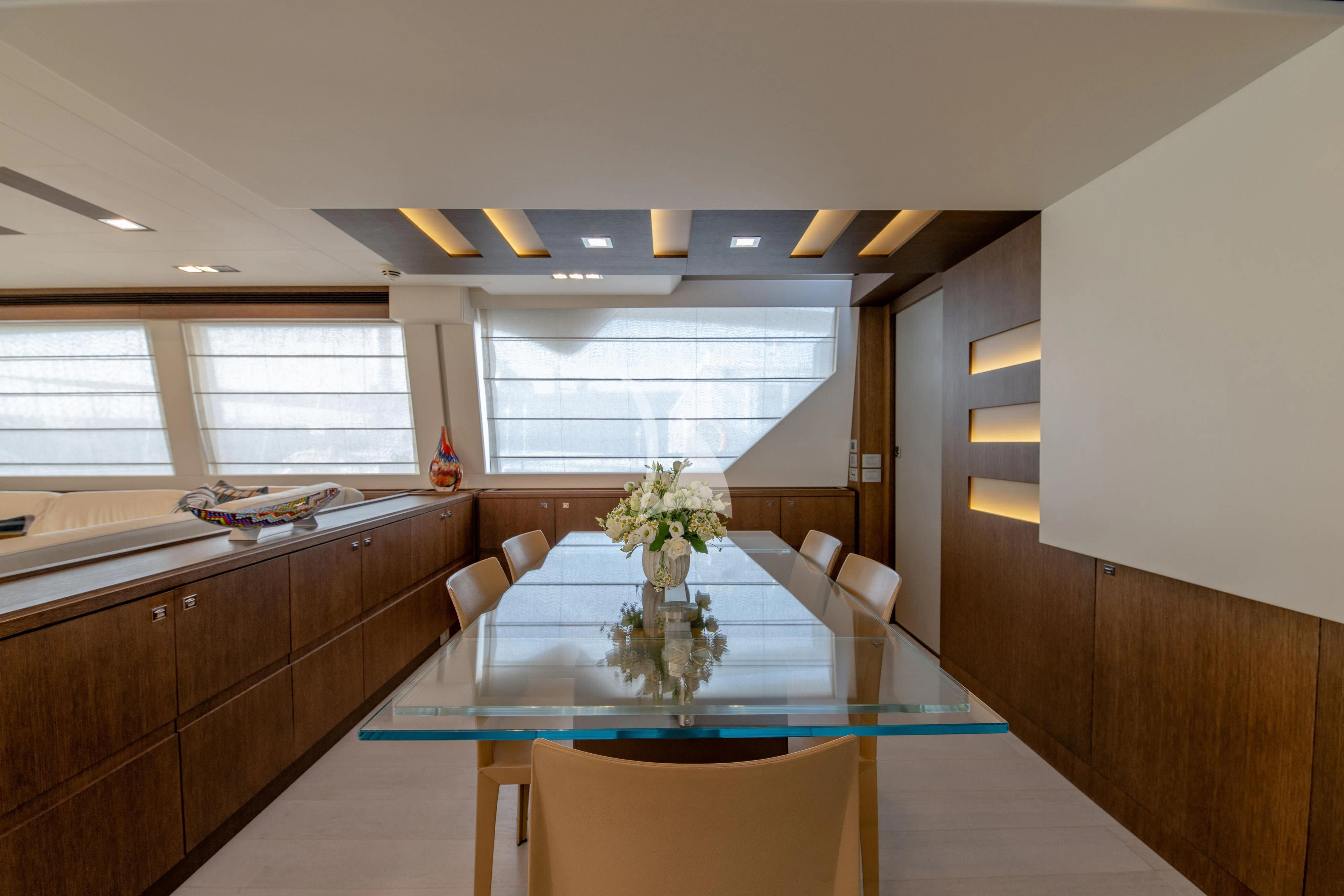 a kitchen with a table and chairs aboard INFINITAS Yacht for Charter