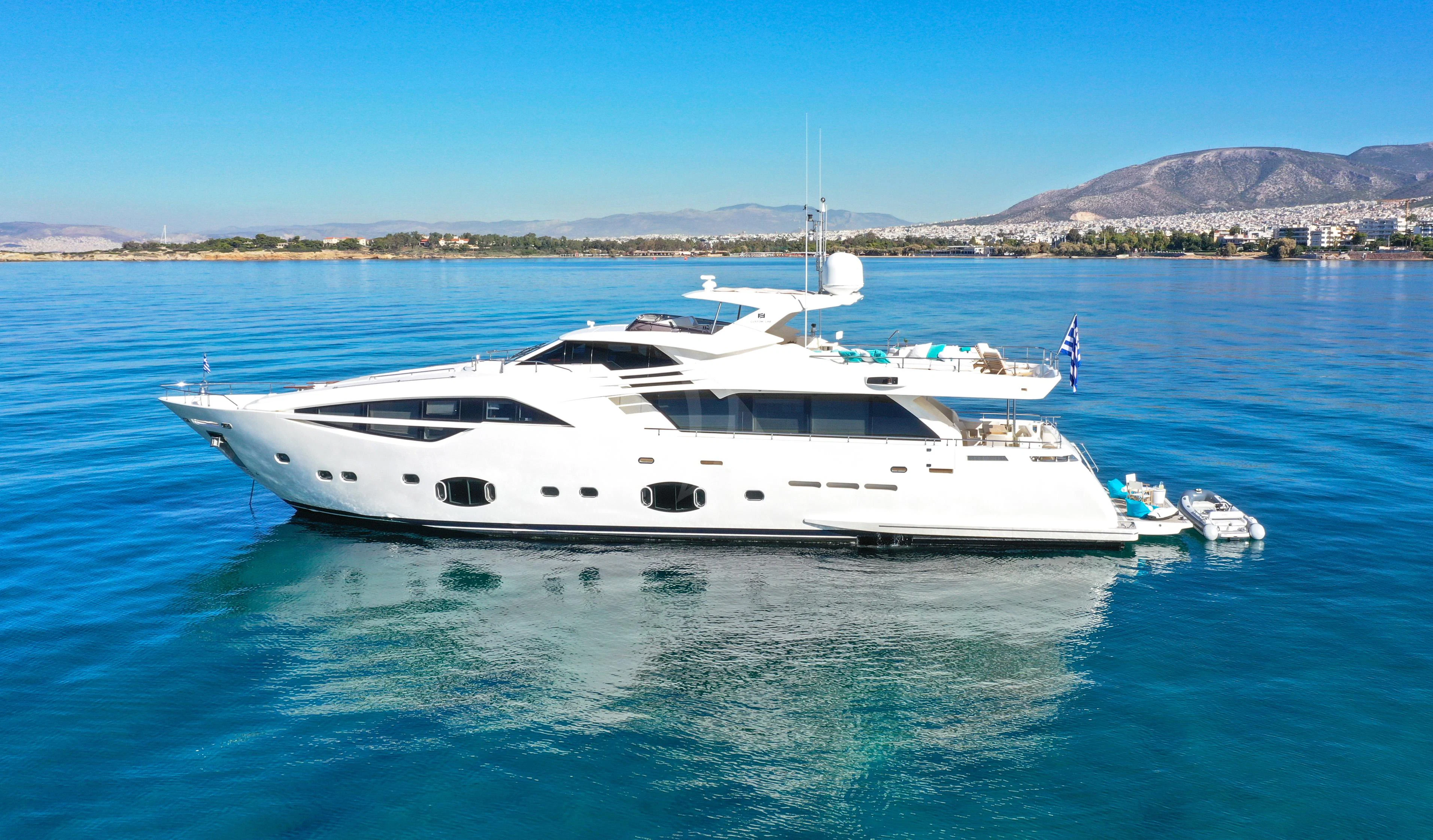a white yacht in the water aboard INFINITAS Yacht for Charter
