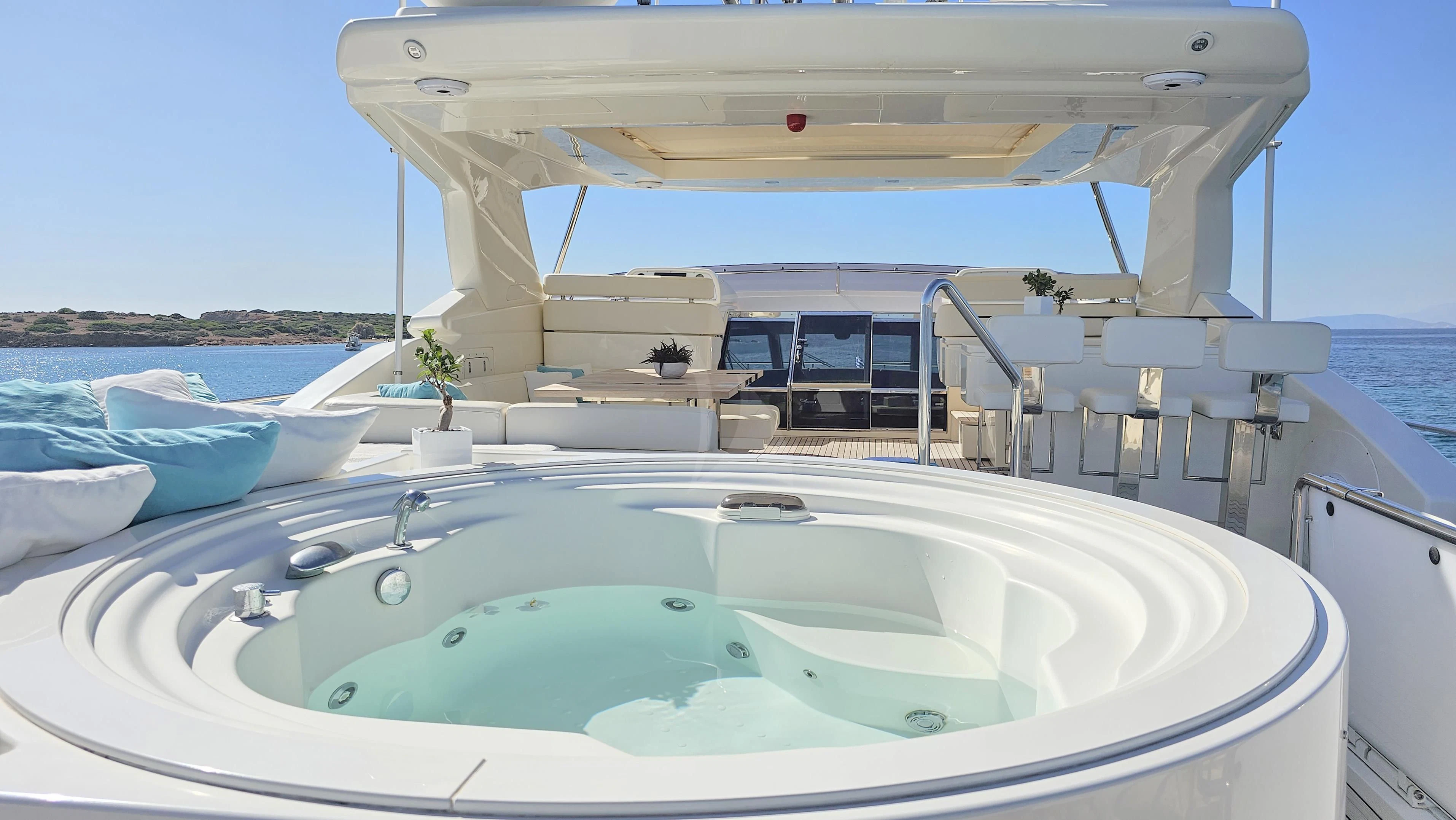 a large white swimming pool aboard INFINITAS Yacht for Charter