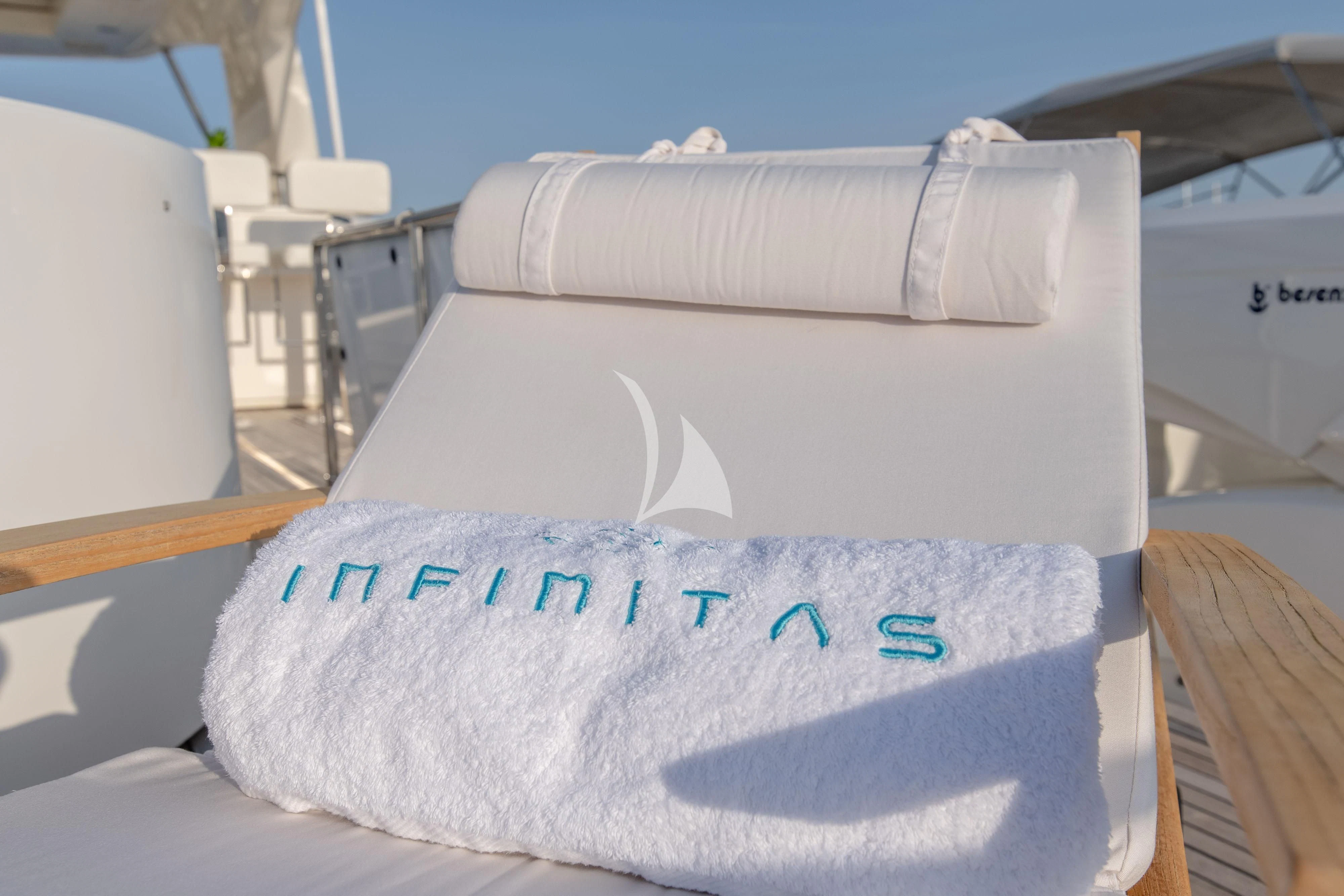 a white surfboard on a boat aboard INFINITAS Yacht for Charter