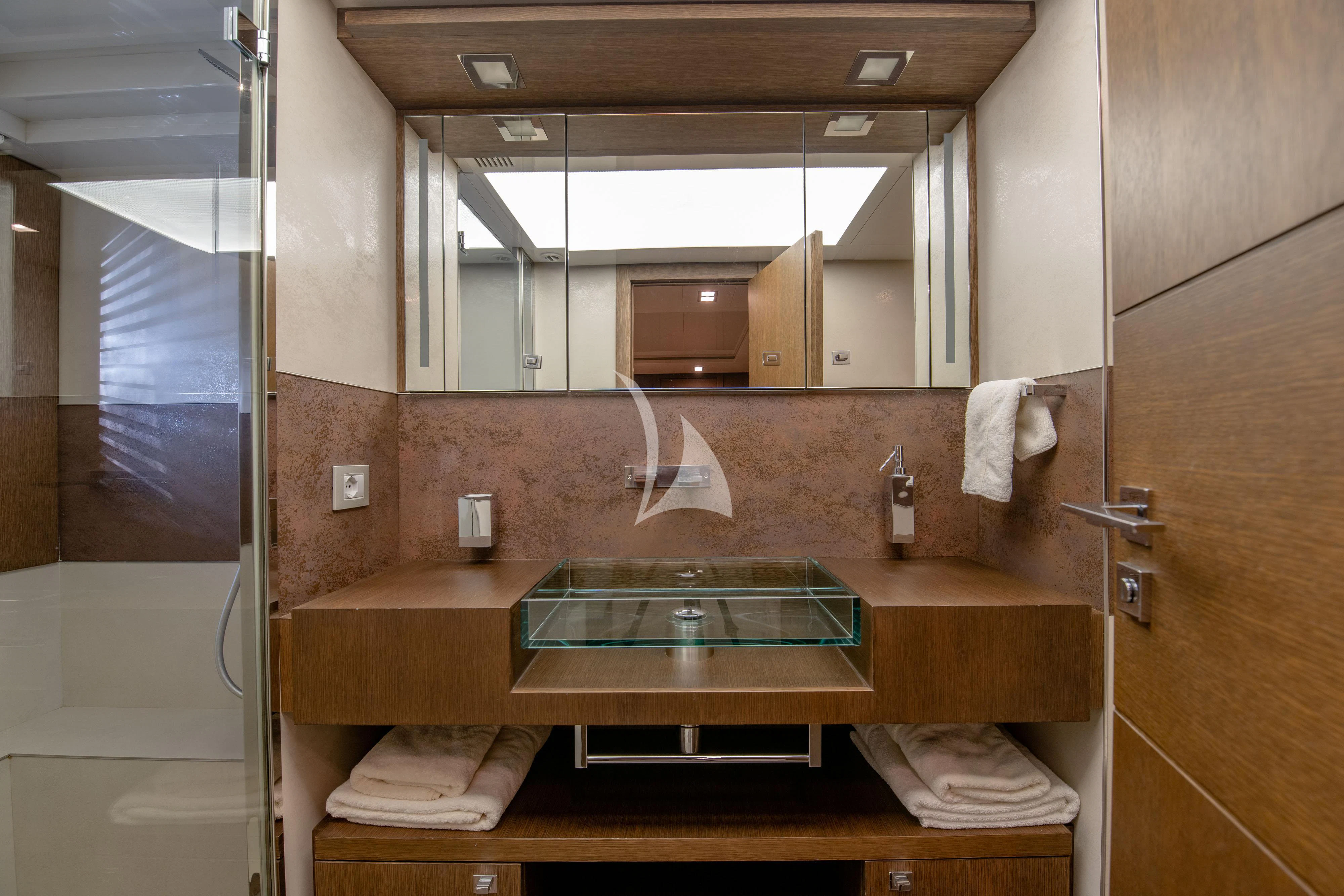 a bathroom with a large mirror aboard INFINITAS Yacht for Charter