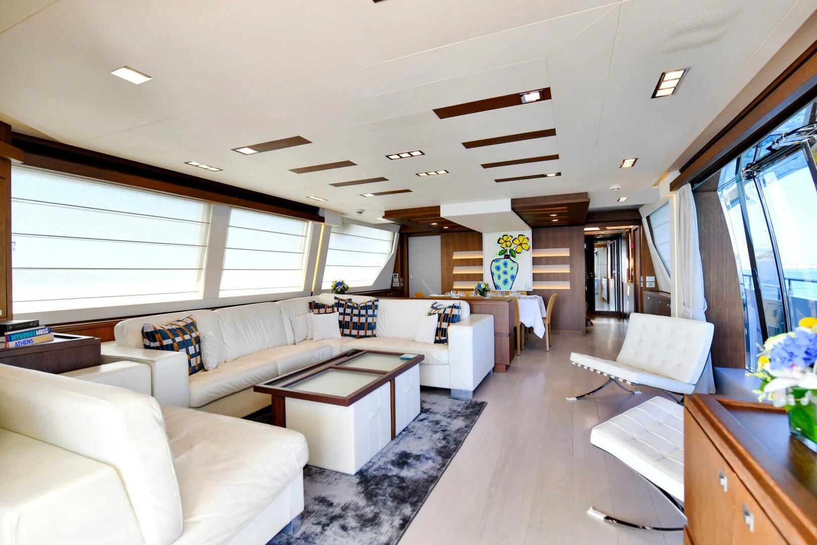 a living room with a ceiling fan aboard INFINITAS Yacht for Charter