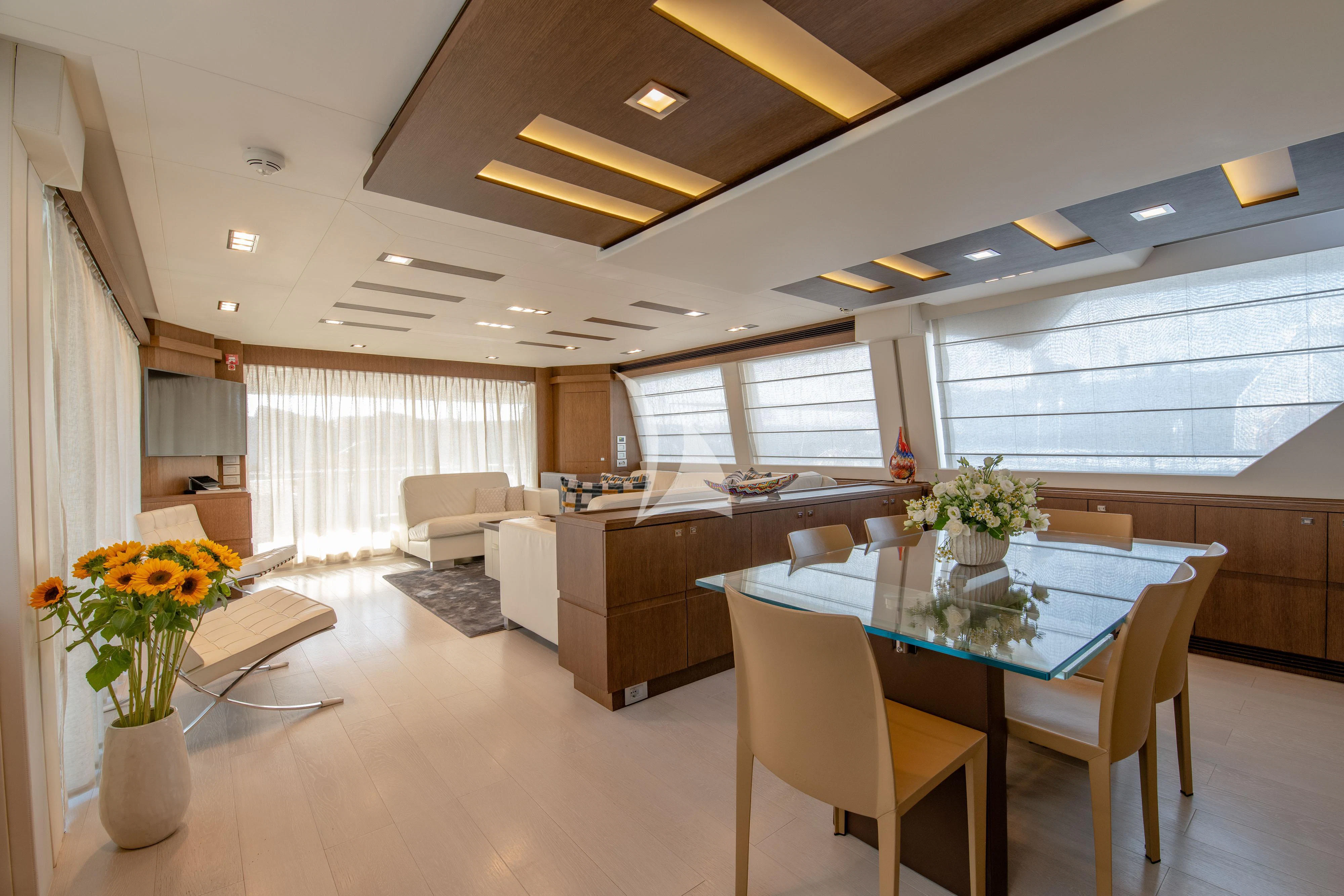 a large open office space aboard INFINITAS Yacht for Charter