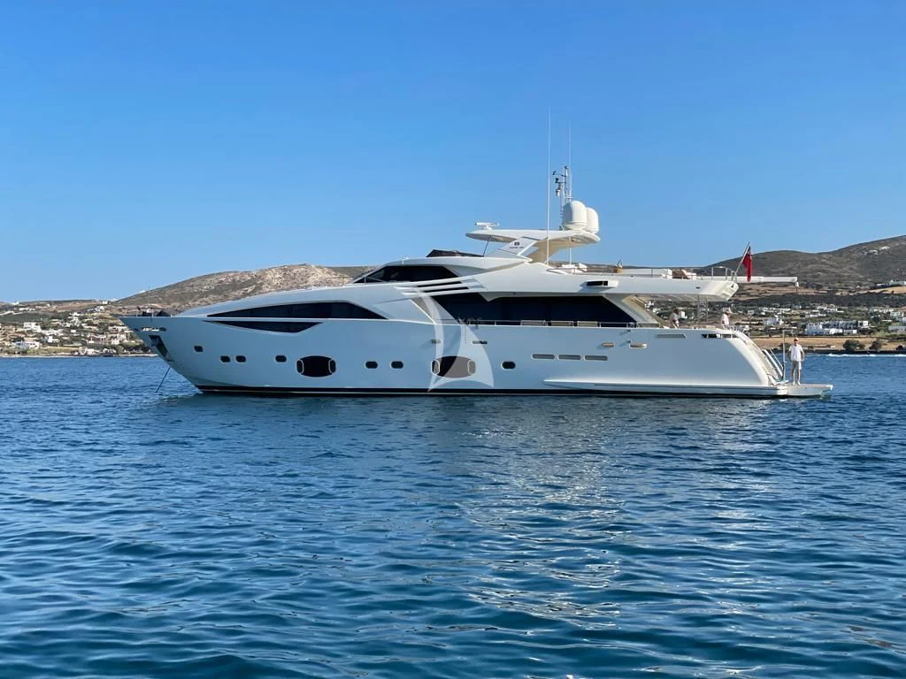a white yacht in the water aboard INFINITAS Yacht for Charter