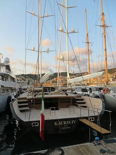 a boat docked at a pier aboard KAURIS IV Yacht for Sale