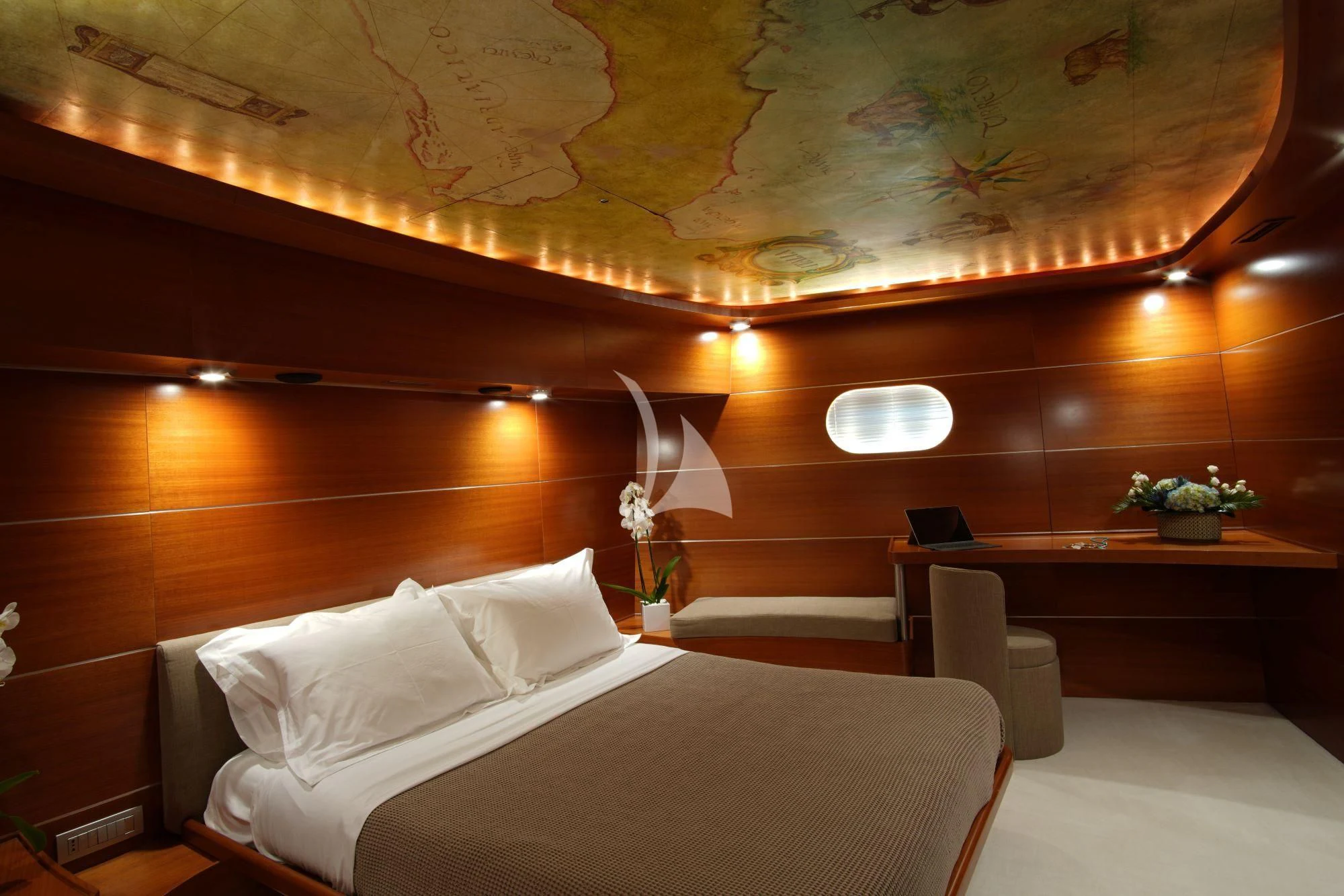 a room with a bed and a desk aboard SATORI Yacht for Sale