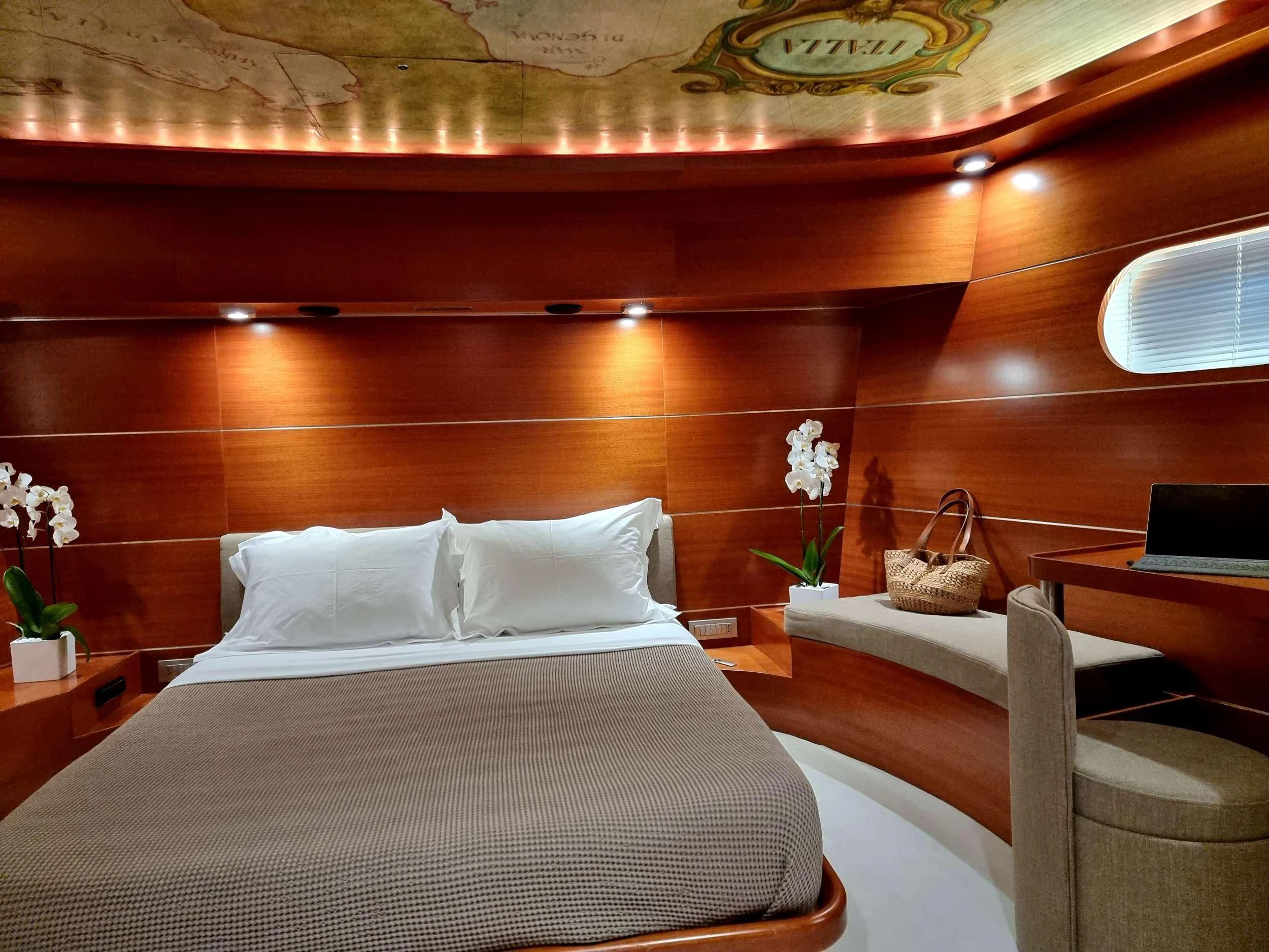 a bed with white sheets and pillows aboard SATORI Yacht for Sale
