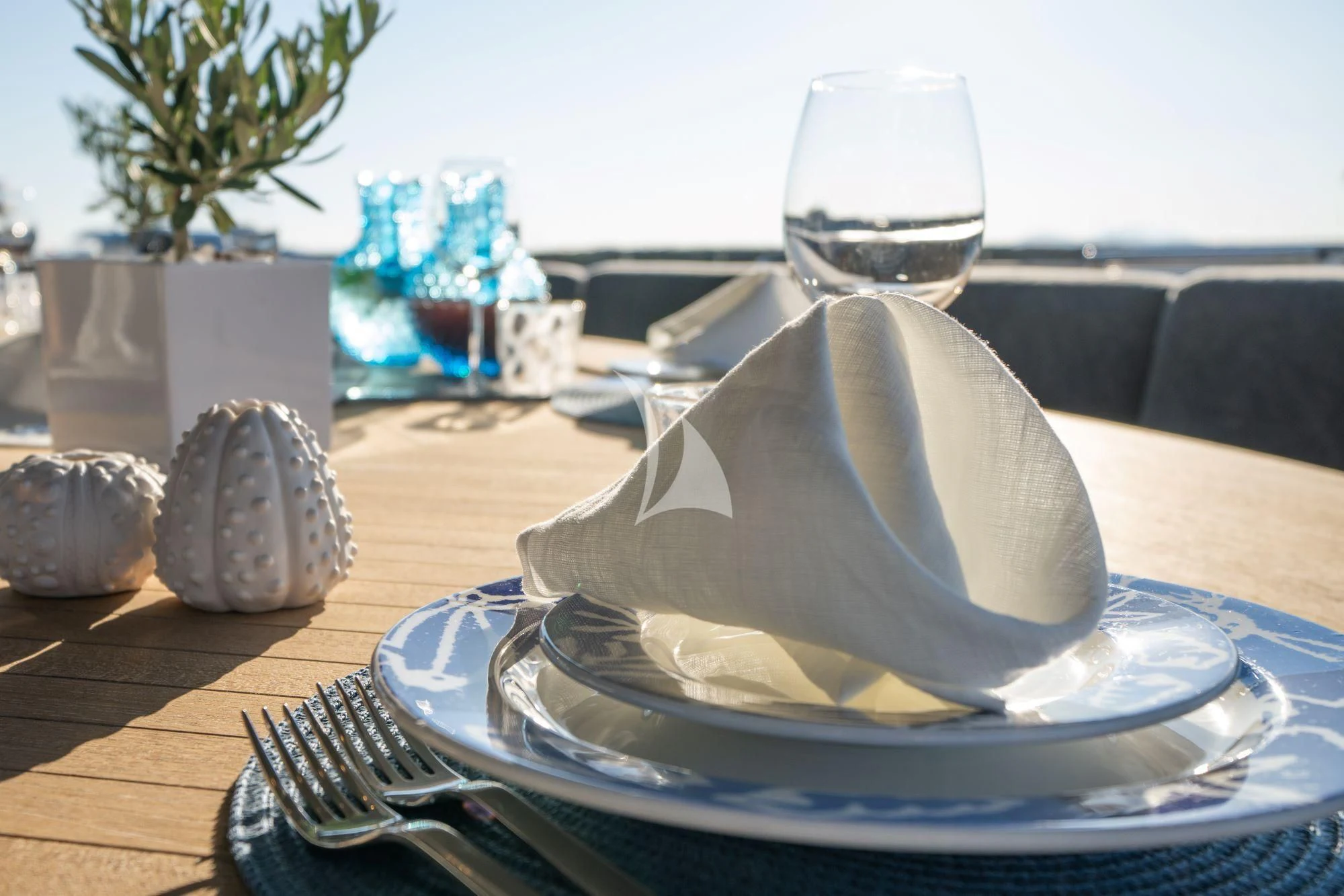a white hat on a plate aboard SATORI Yacht for Sale