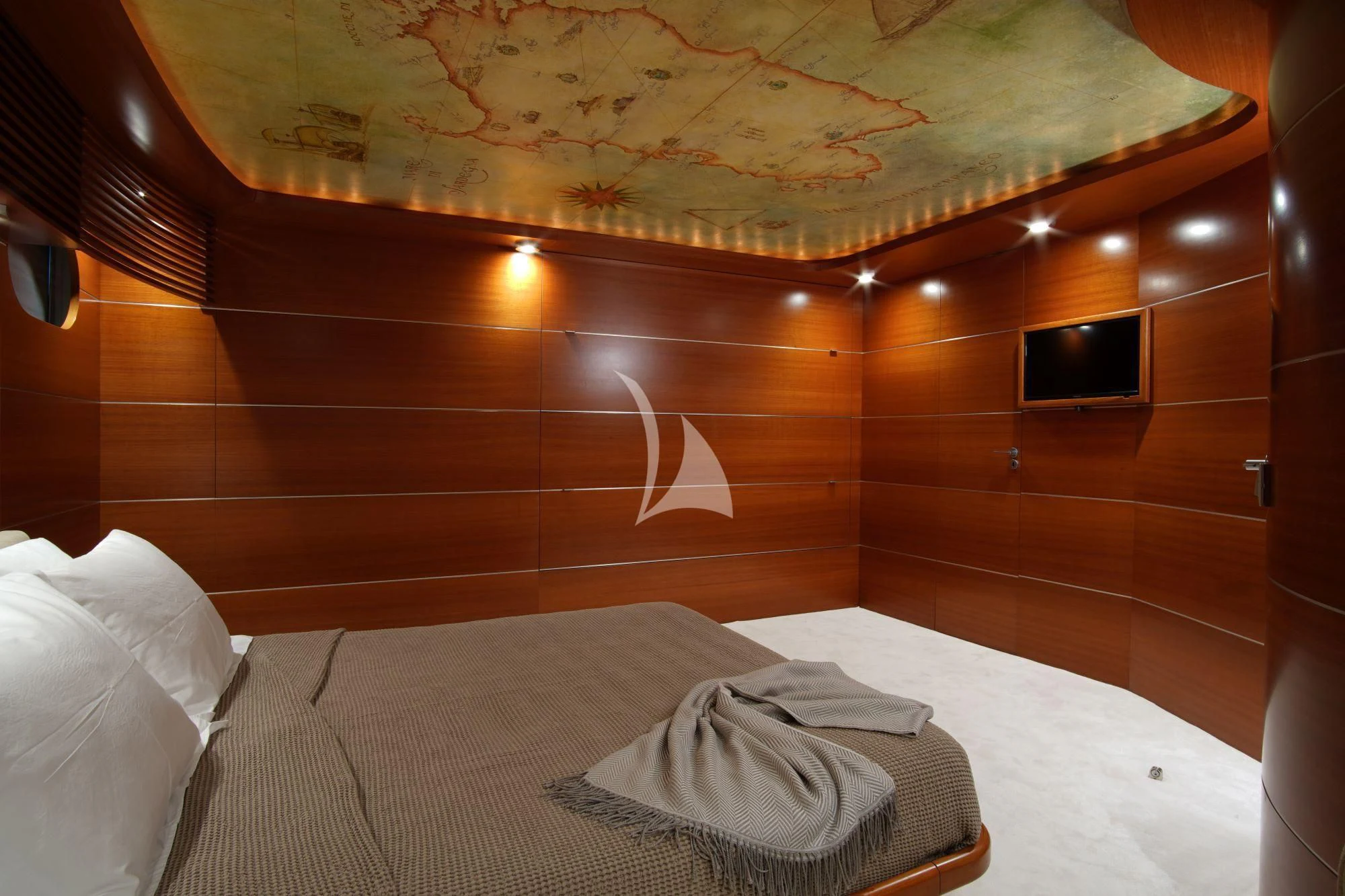 a room with a bed and a television aboard SATORI Yacht for Sale