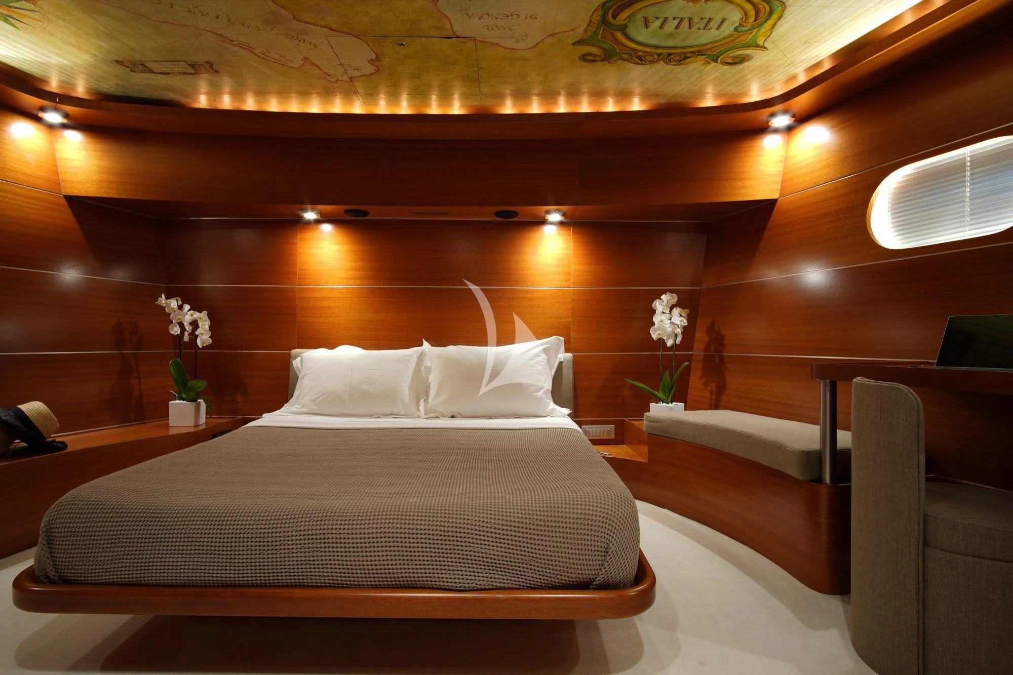 a bed with white sheets aboard SATORI Yacht for Sale