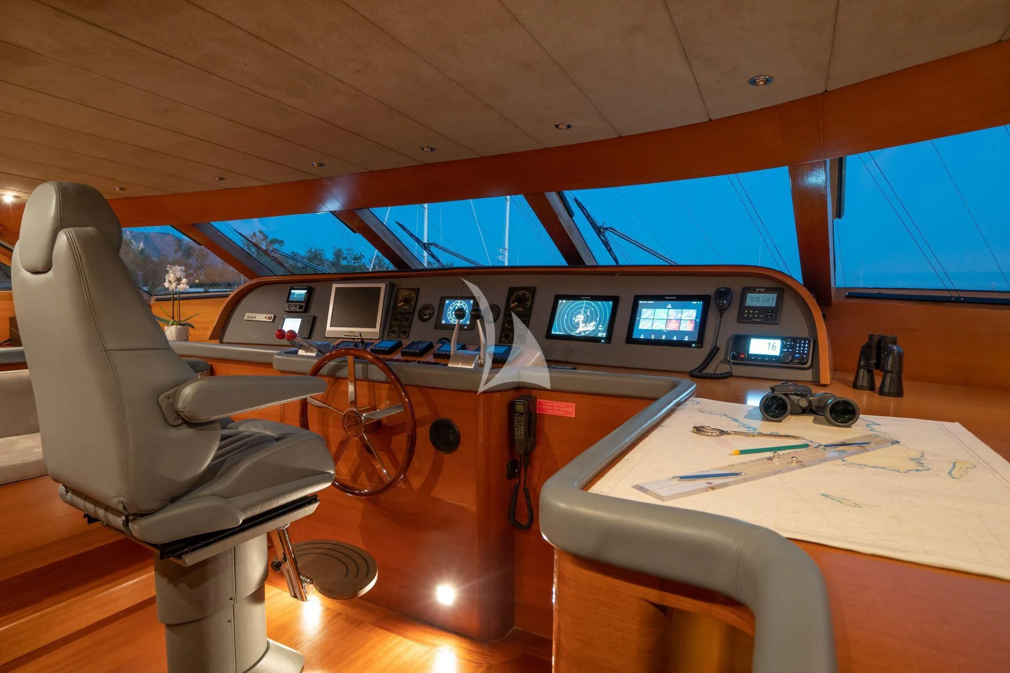 a room with a desk and chairs aboard SATORI Yacht for Sale