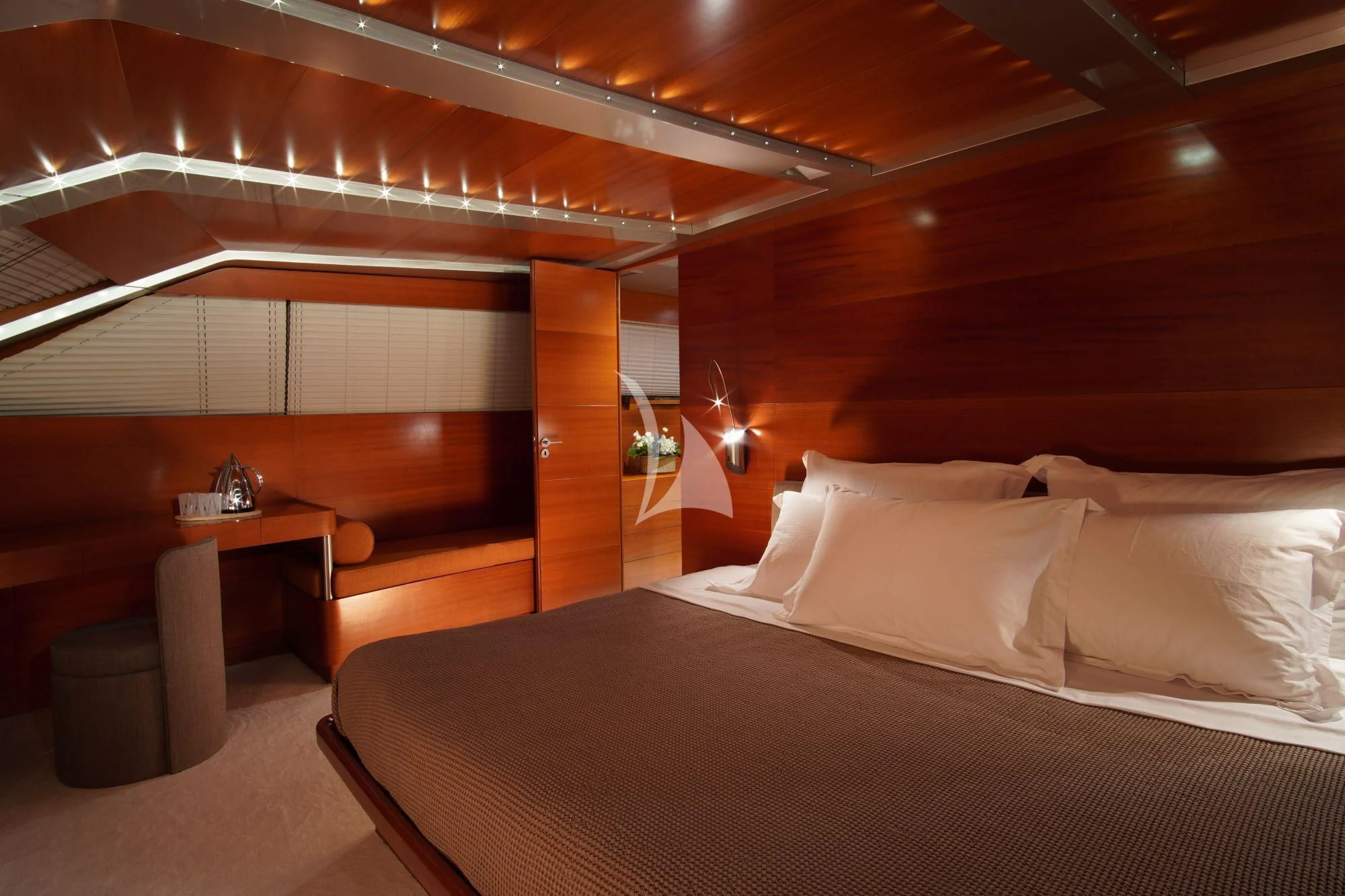 a bed with white sheets aboard SATORI Yacht for Sale