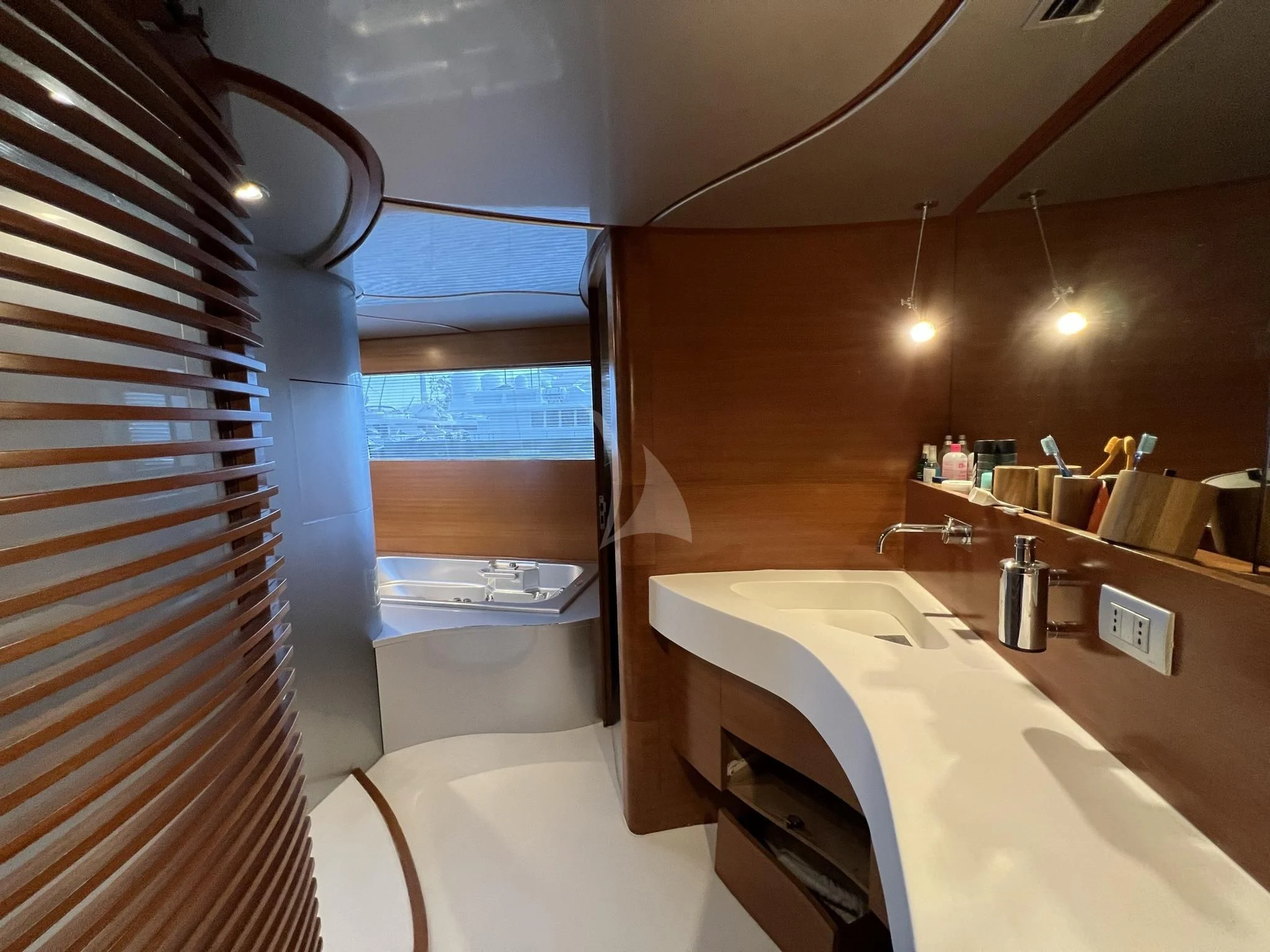 a bathroom with a tub sink and a shower aboard SATORI Yacht for Sale