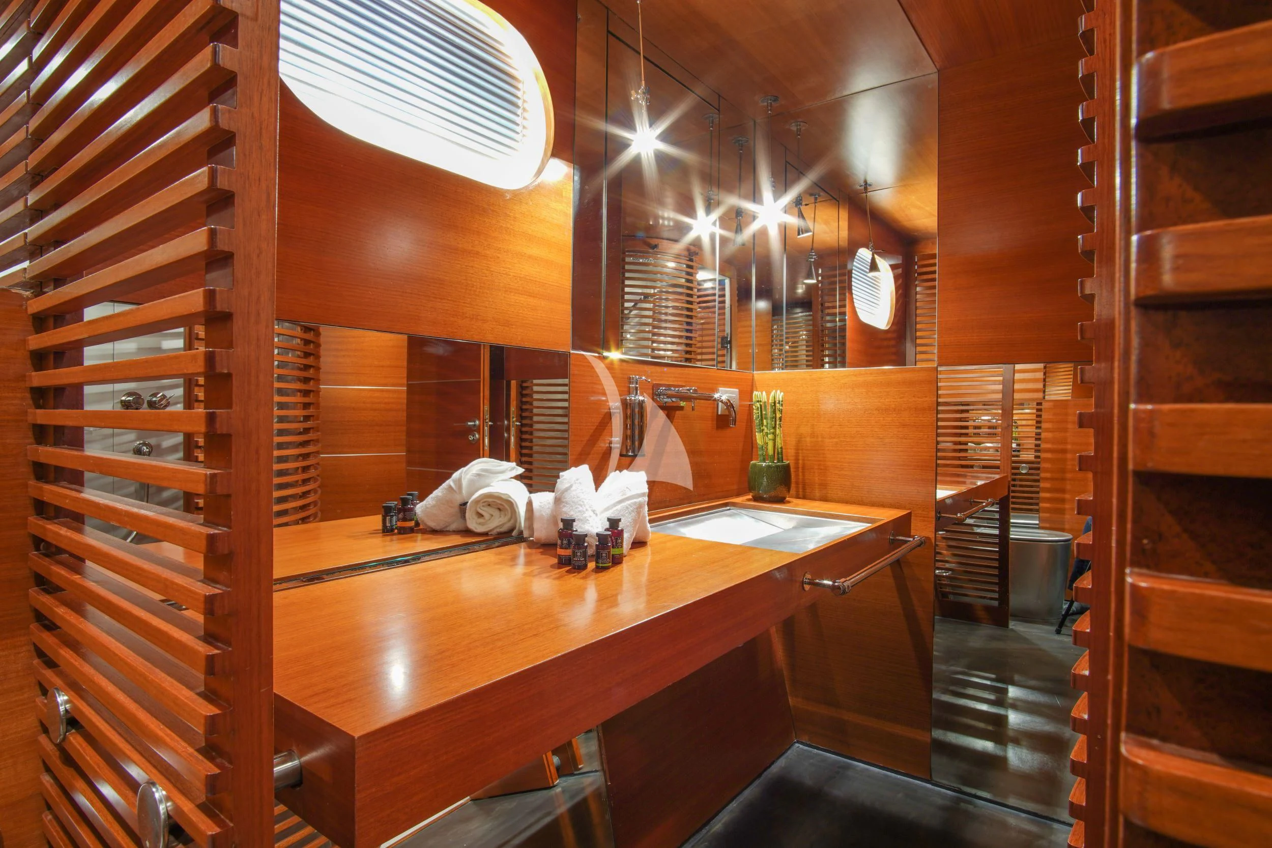 a kitchen with a table and chairs aboard SATORI Yacht for Sale