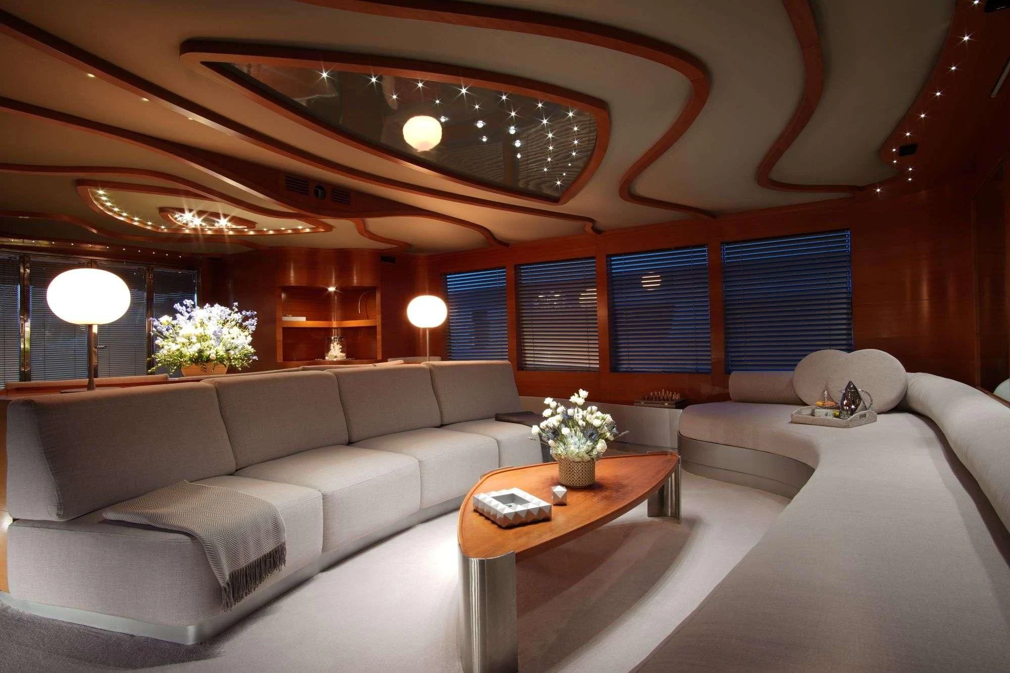 a room with couches and a table aboard SATORI Yacht for Sale