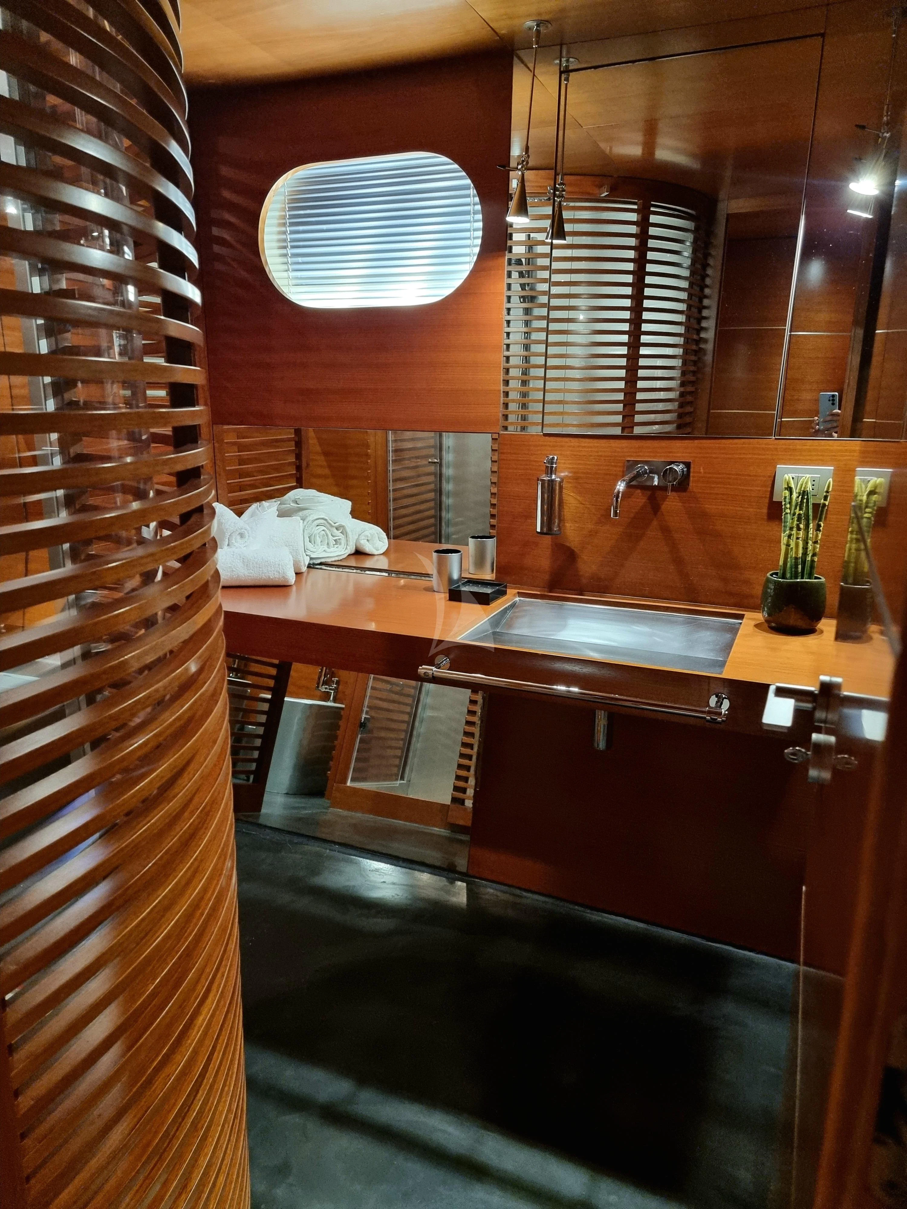 a bathroom with a sink and a shower aboard SATORI Yacht for Sale