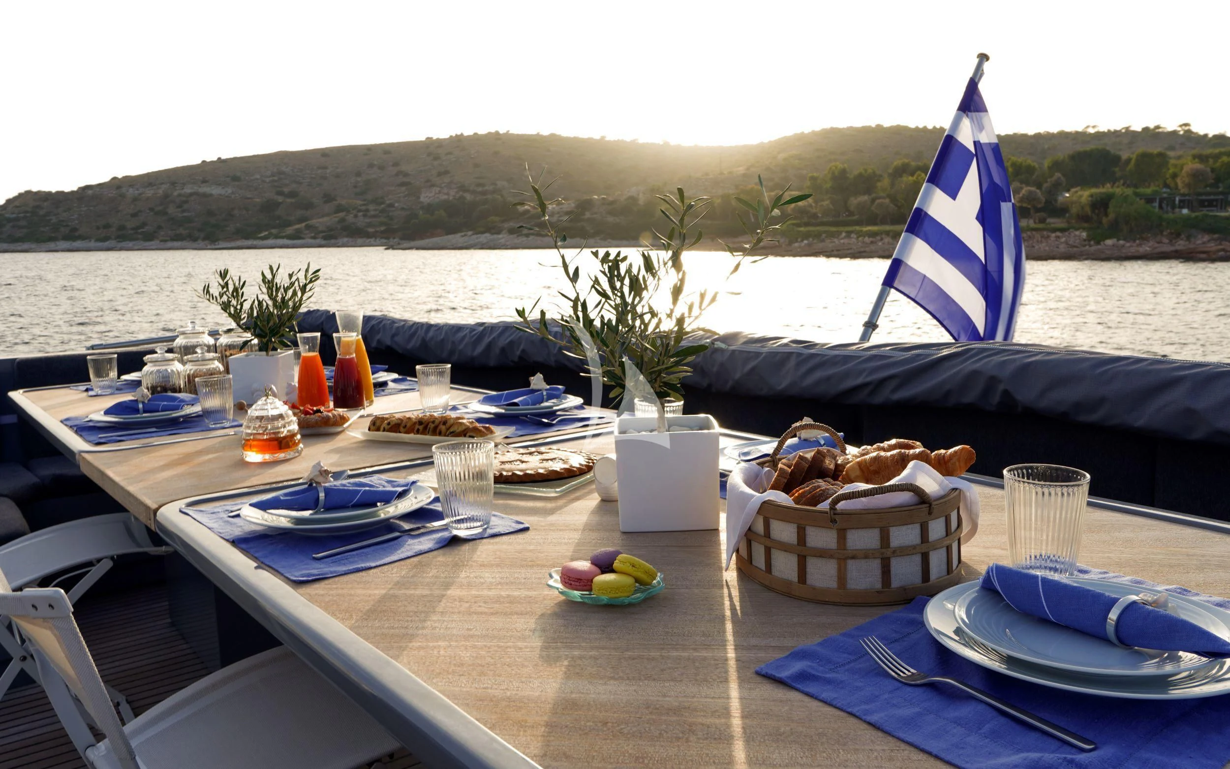 a table with food and drinks on it aboard SATORI Yacht for Sale