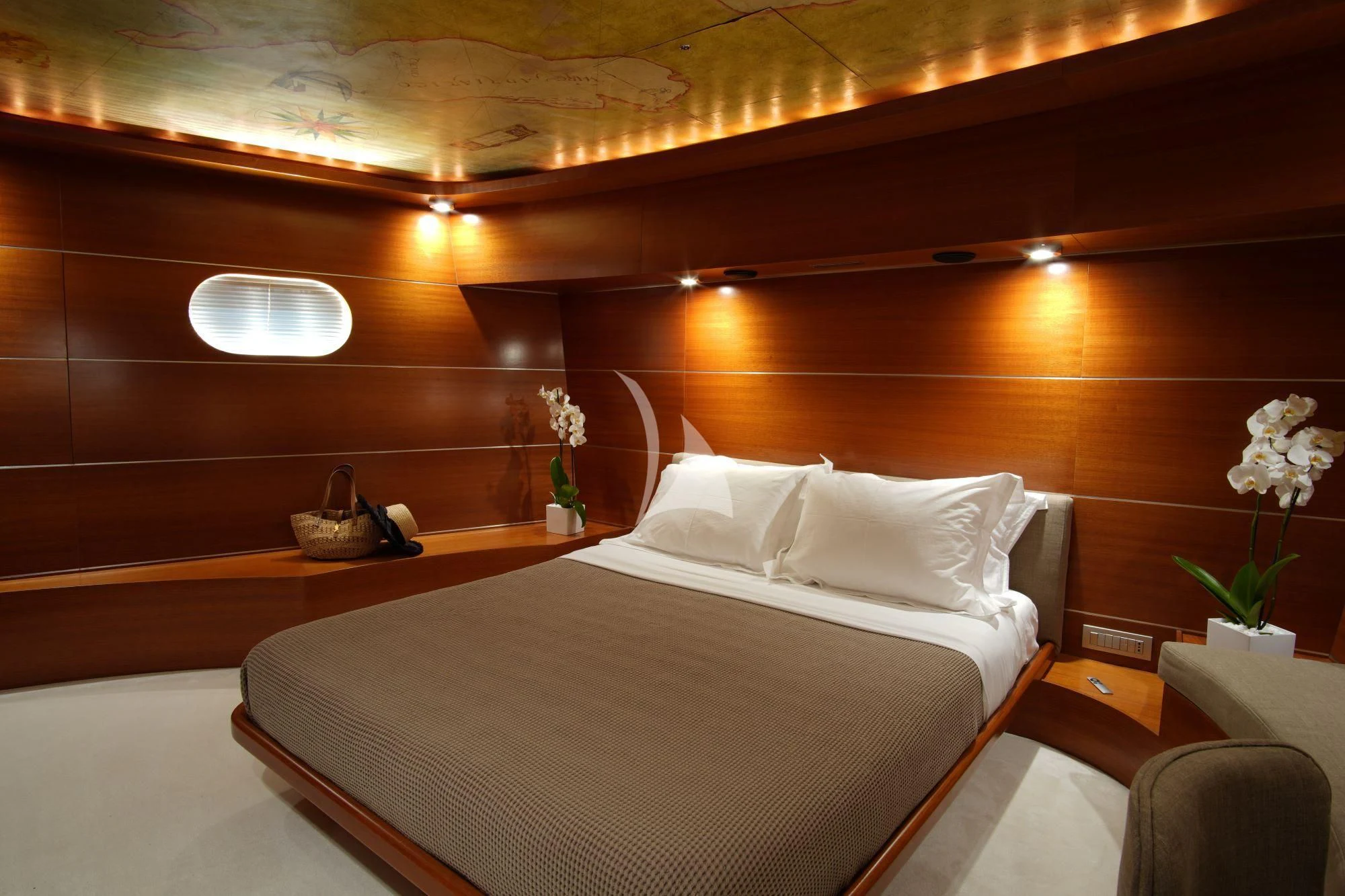 a bed with white sheets aboard SATORI Yacht for Sale